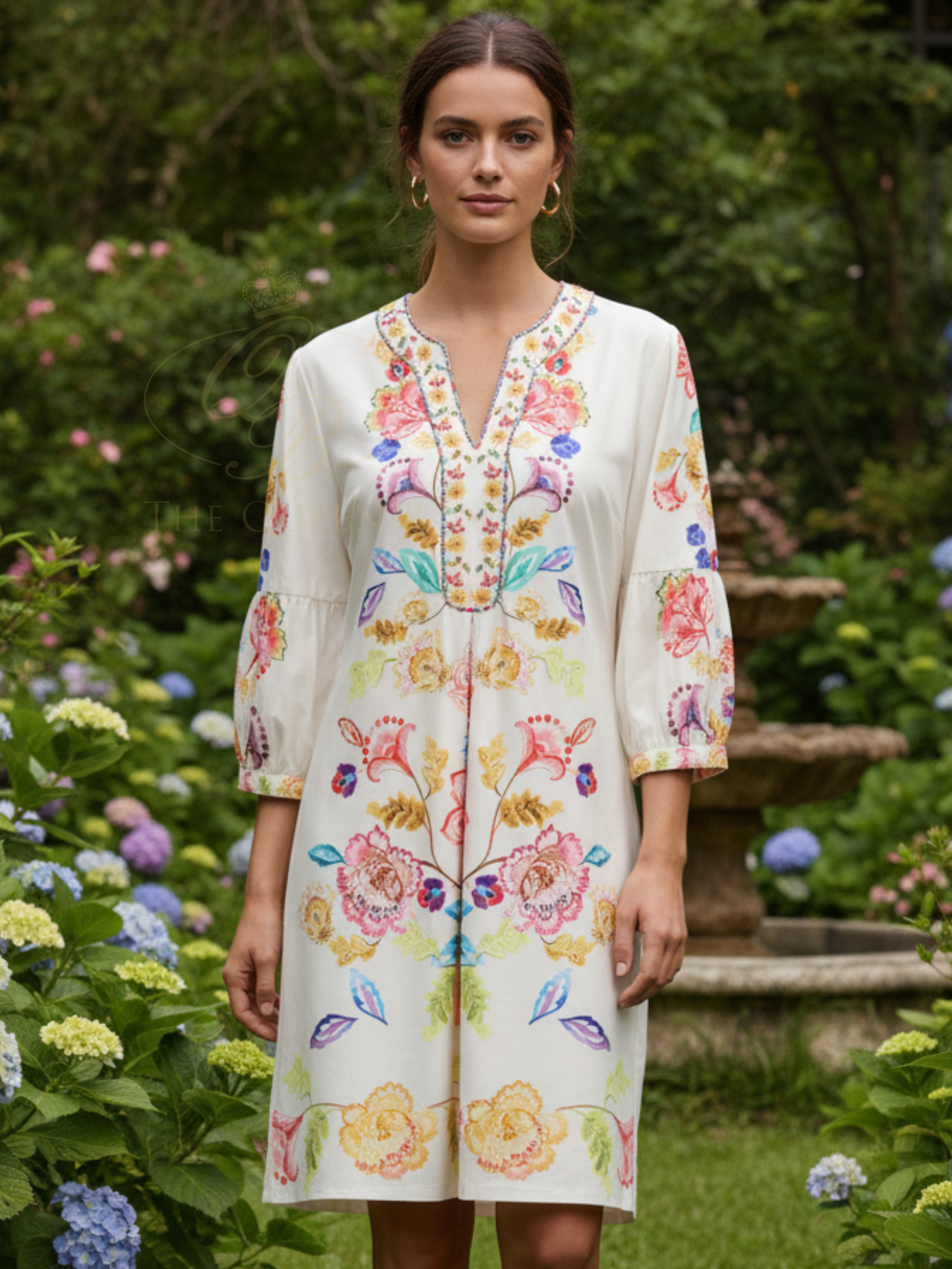 K Design C408 Dress knee-length printed dress with V-neckline, decorative trim detail, three-quarter sleeves and symmetrical floral motif design.