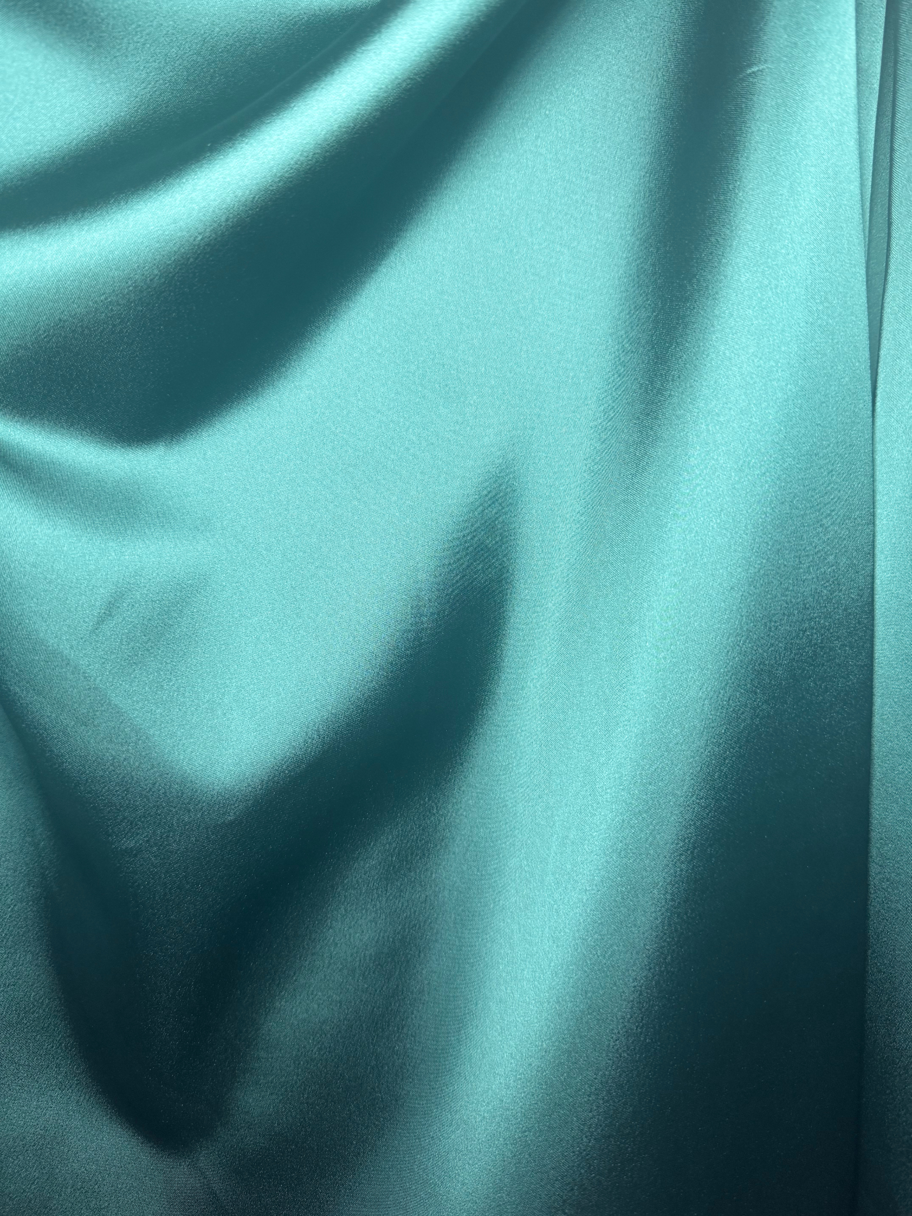 Kevan Jon Kris British Racing Green Dress with bardot neckline, ruched bodice, fitted skirt, flowing overskirt and oversized rosette detail.