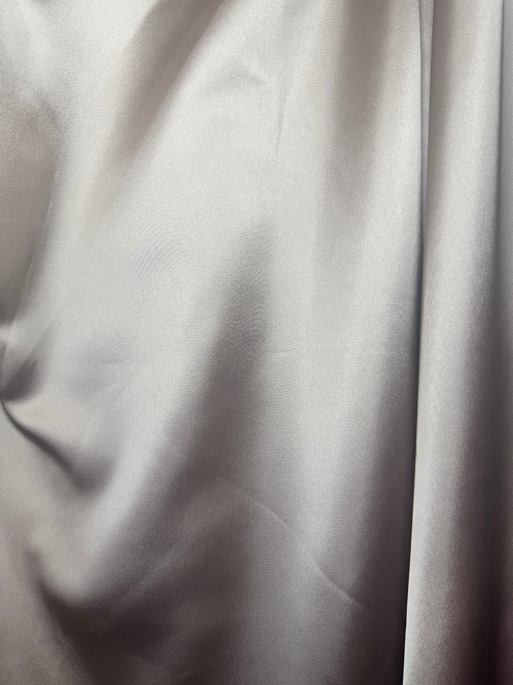 Kevan Jon Kris Mocha Dress with bardot neckline, ruched bodice, fitted skirt, flowing overskirt and oversized rosette detail.