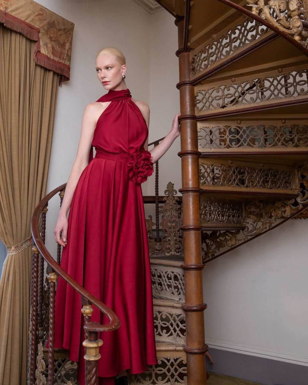 Maisonel ME3004 Raspberry Dress – women’s halter neck satin occasion gown in rich raspberry red with floral waist detail and flowing skirt. Perfect for weddings, galas, and formal events.