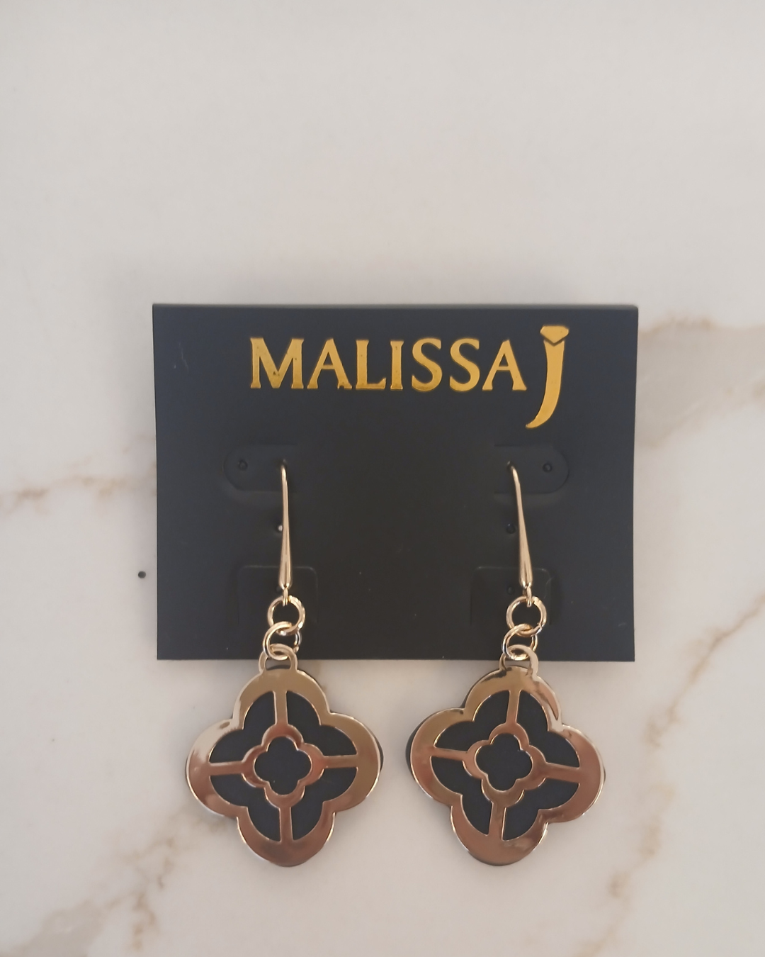 Gold and black dangling earrings