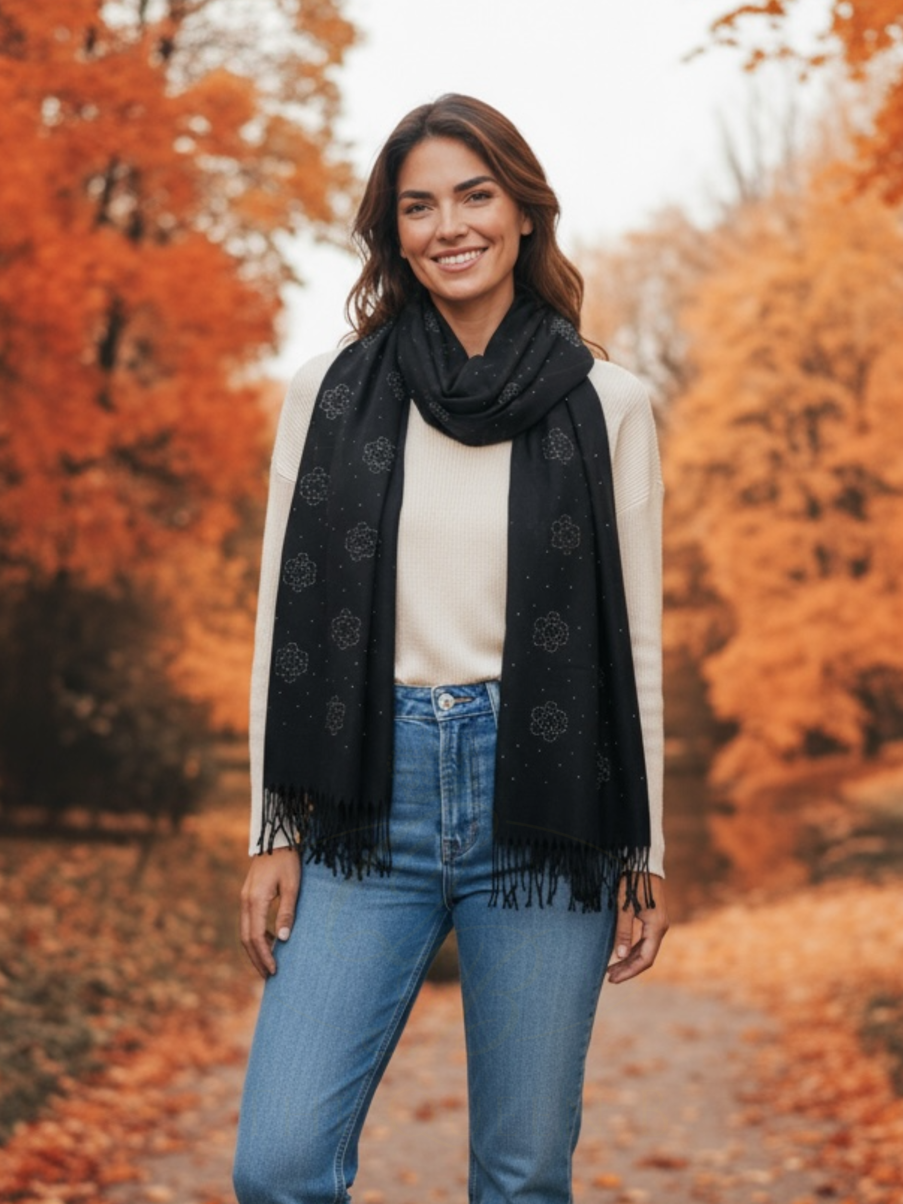 Malissa J GC21283 Black Flower Studded Scarf with Tassel Detail – women’s luxury winter scarf in black with floral stud design and tassel trim. Elegant, soft-touch accessory for day-to-night fashion styling