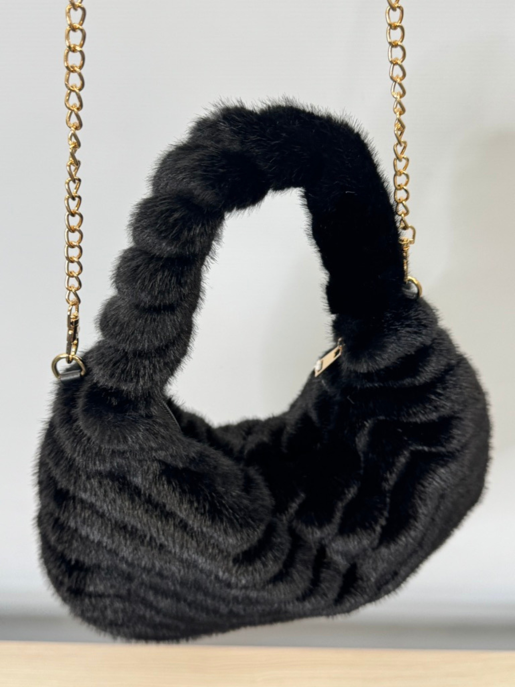 Malissa J GC21344 black horseshoe faux fur bag with swirl design and gold chain strap-luxury women’s statement handbag.