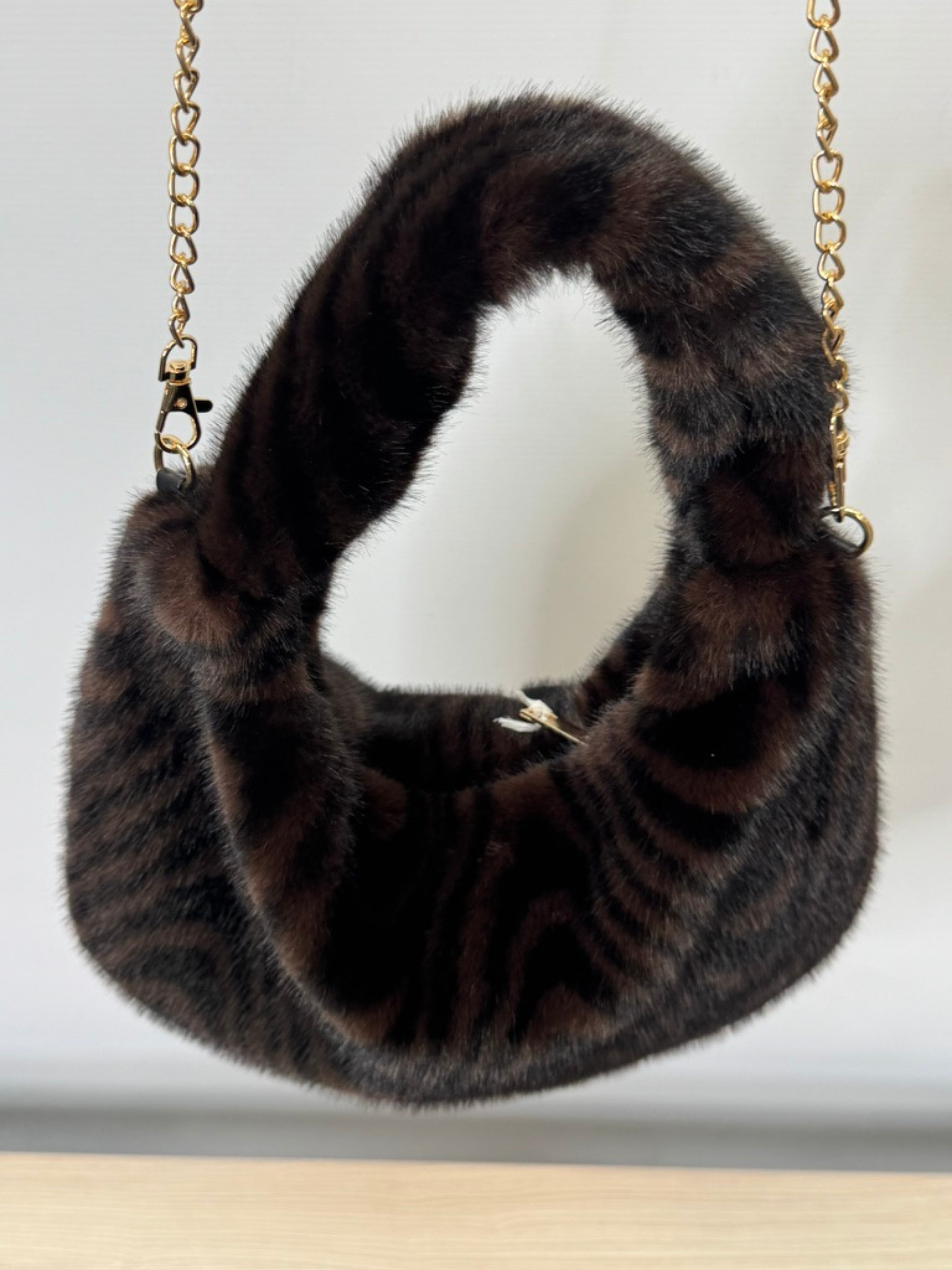 Malissa J GC21344 swirl horseshoe faux fur bag with swirl design and gold chain strap-luxury women’s statement handbag.