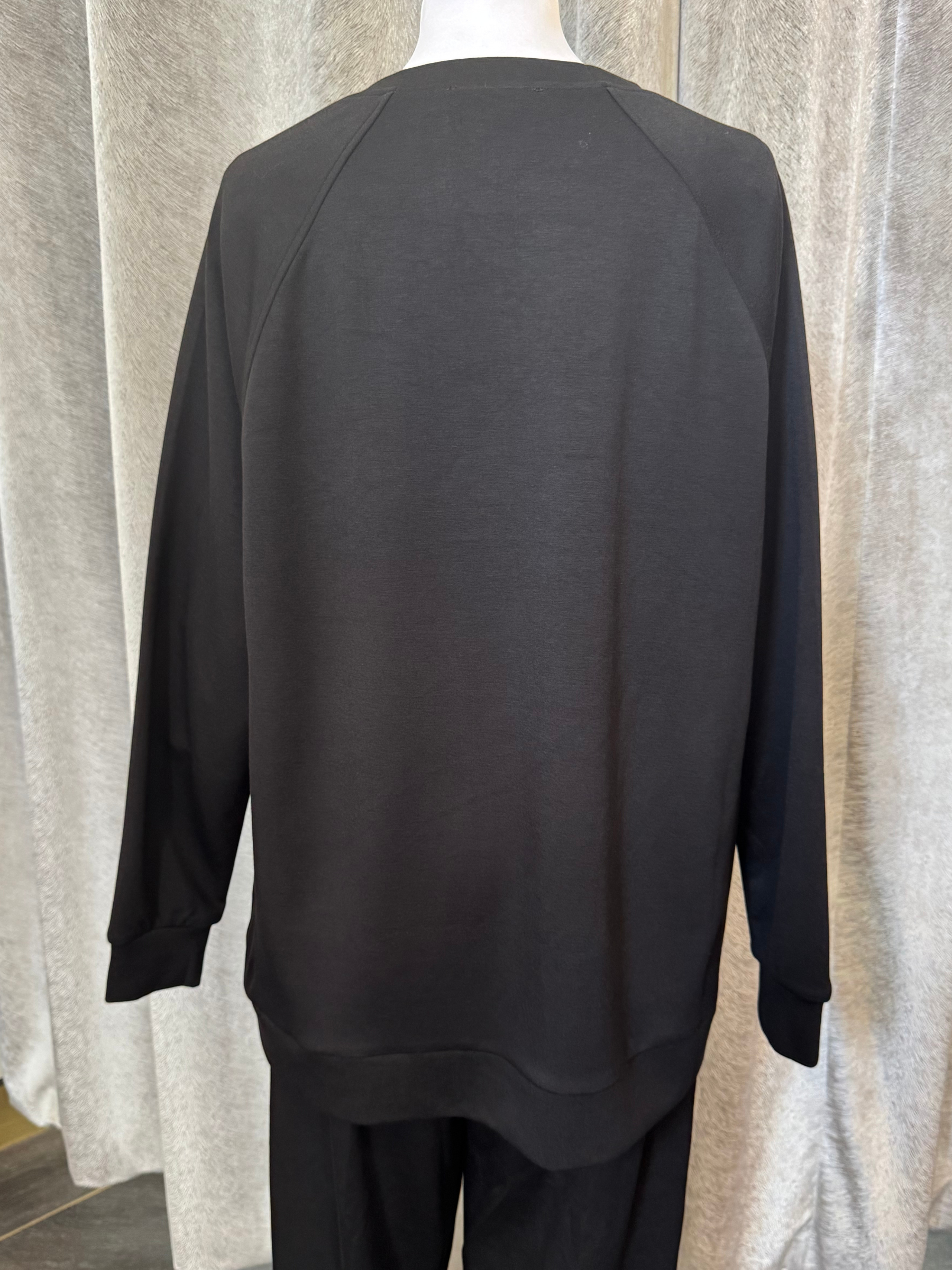 Malissa J WF2555 Black PU Top with long sleeves and PU-trim pockets-women’s neutral longline top with eyelet detail.