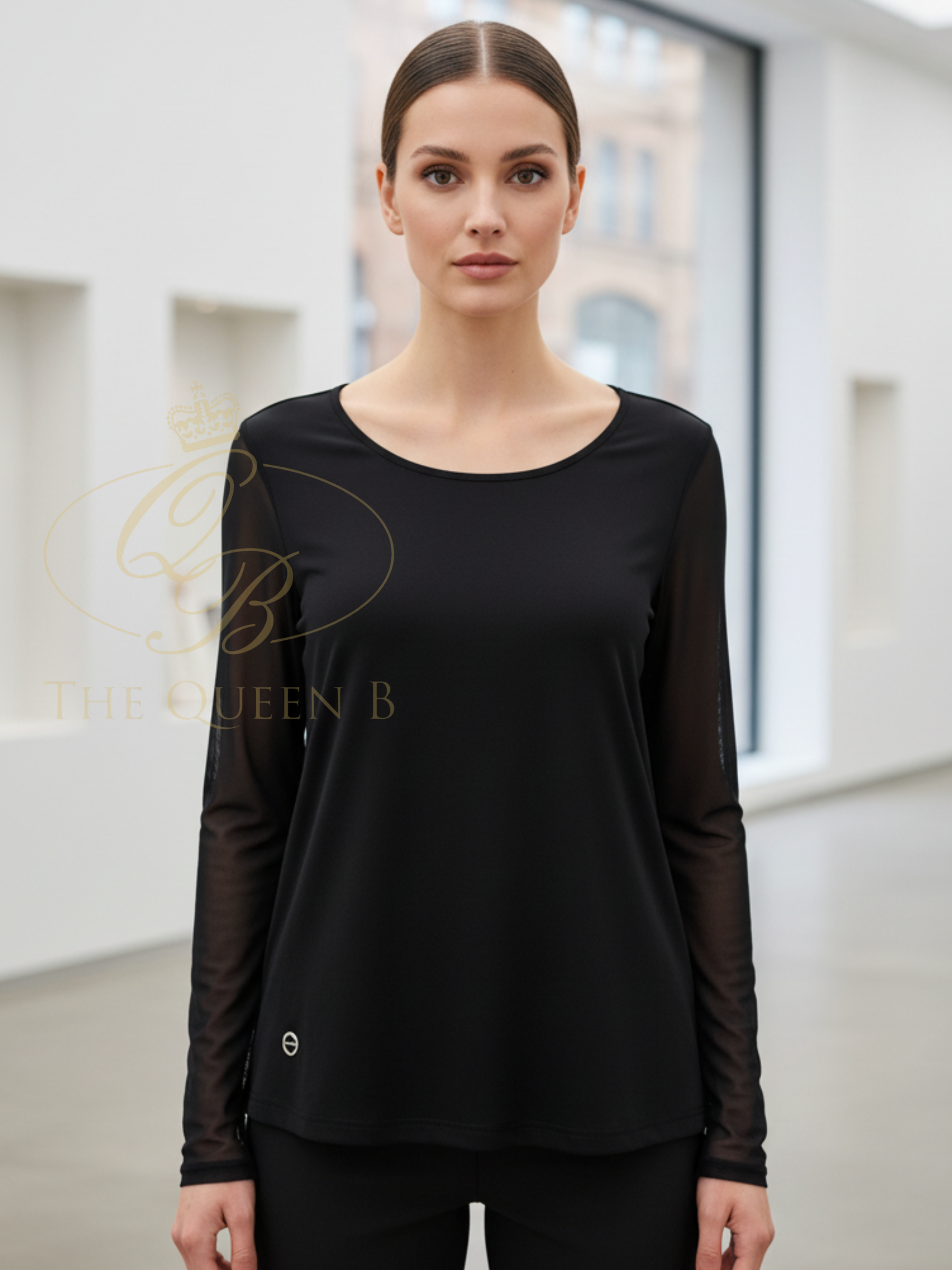 Malissa J WF2621A Mesh Sleeve Jersey Top with round neckline, fitted silhouette and sheer mesh long sleeves.