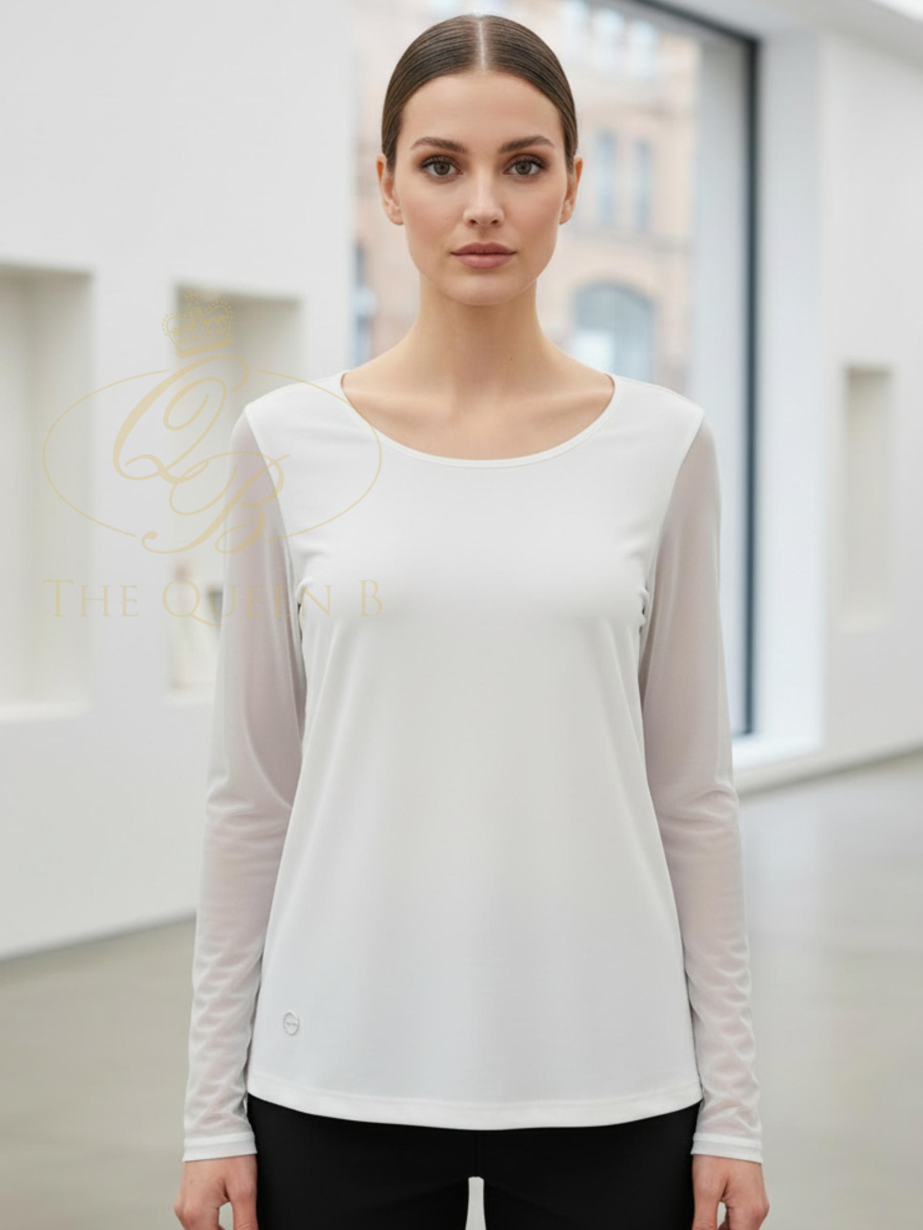 Malissa J WF2621A Mesh Sleeve Jersey Top with round neckline, fitted silhouette and sheer mesh long sleeves.