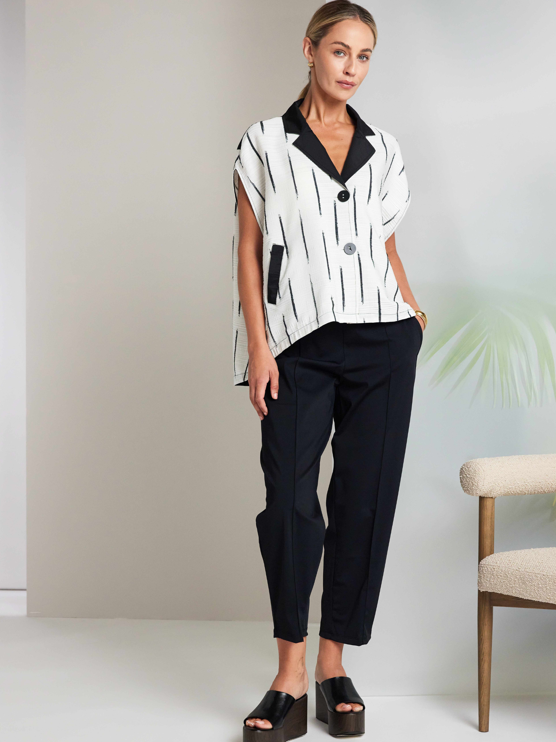 Naya NAS26 102 Drawstring Trousers in black featuring an adjustable drawstring waist and relaxed, modern silhouette.