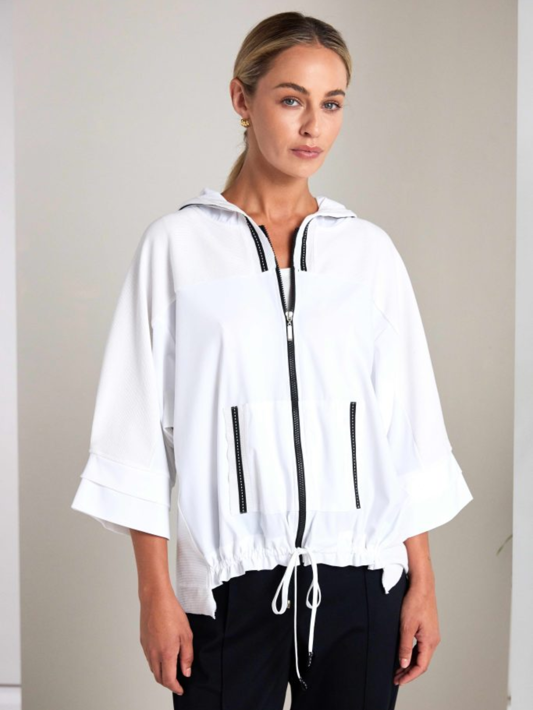 Naya NAS26 171 High Neck Zip Top featuring zip-front fastening, high neckline and contrast fabric detailing.