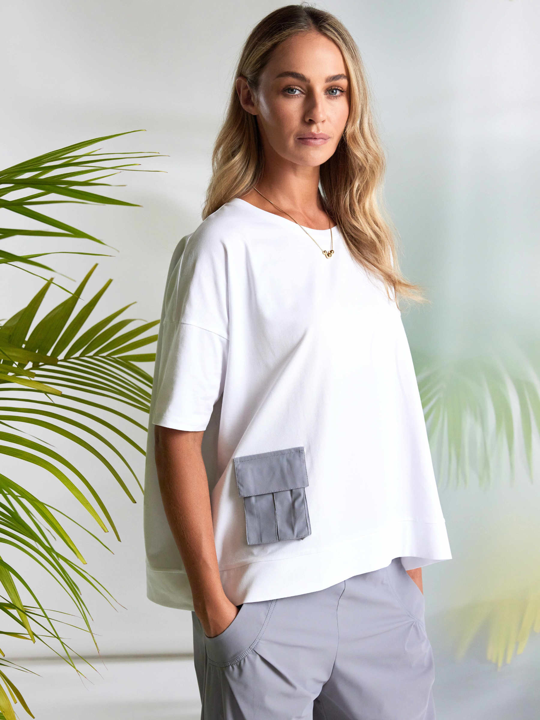 Naya NAS26 212 round neck women’s top with relaxed fit, short sleeves and contrast pocket detail.