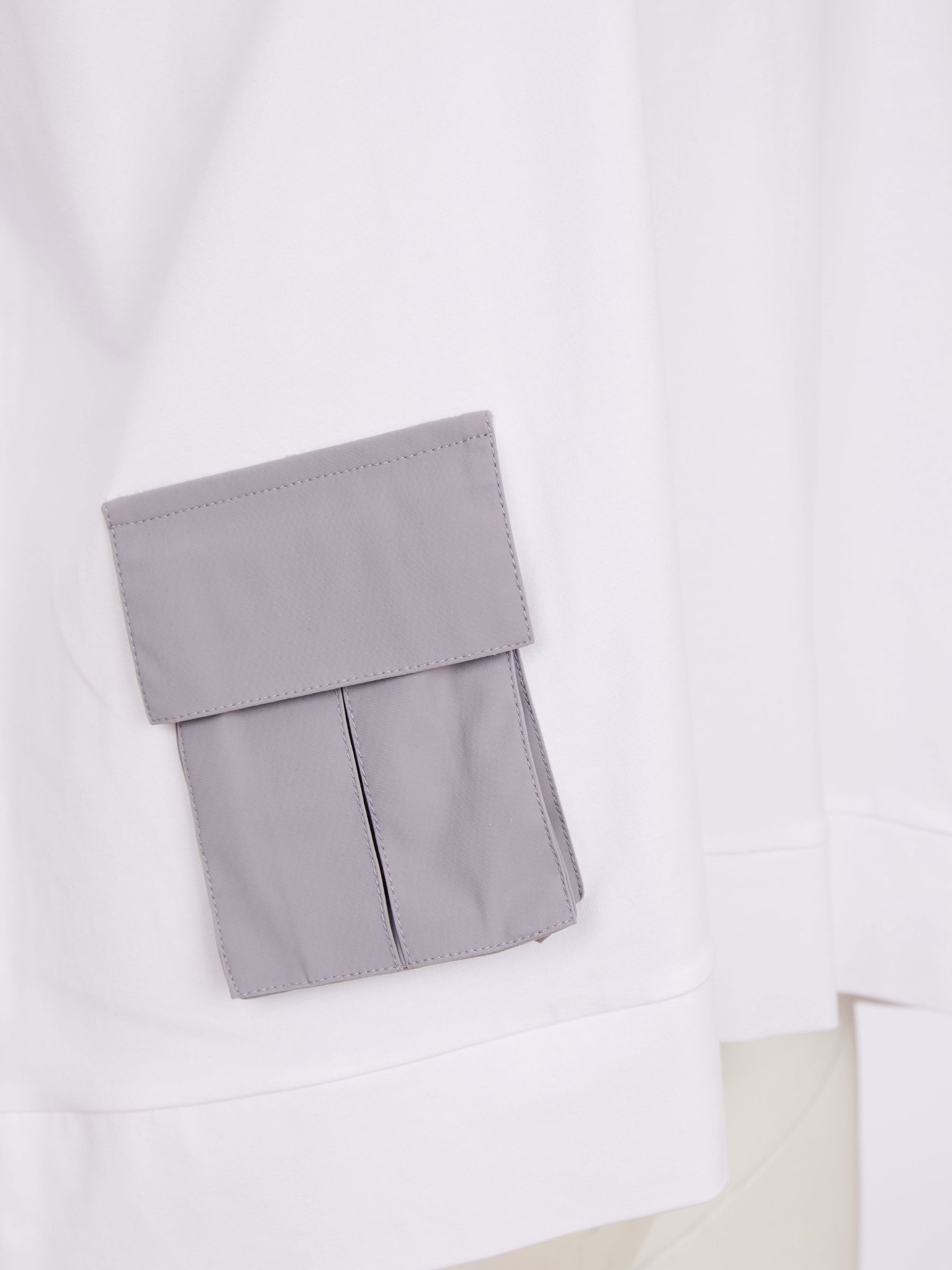 Naya NAS26 212 round neck women’s top with relaxed fit, short sleeves and contrast pocket detail.