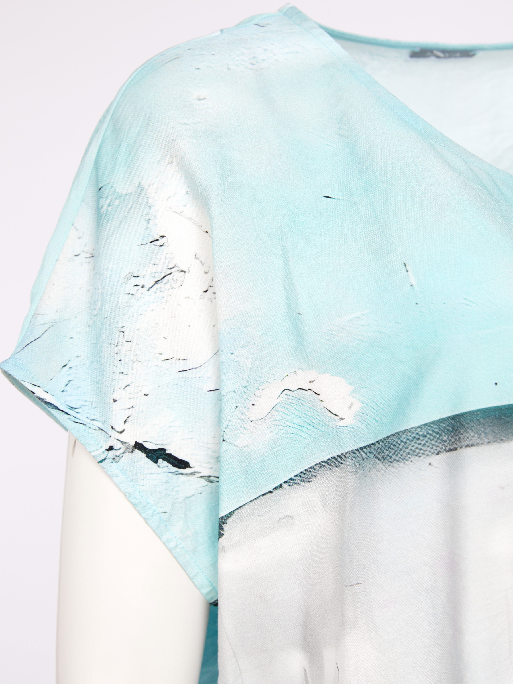 Naya NAS26 299 square shape faded print top with relaxed fit and modern silhouette.