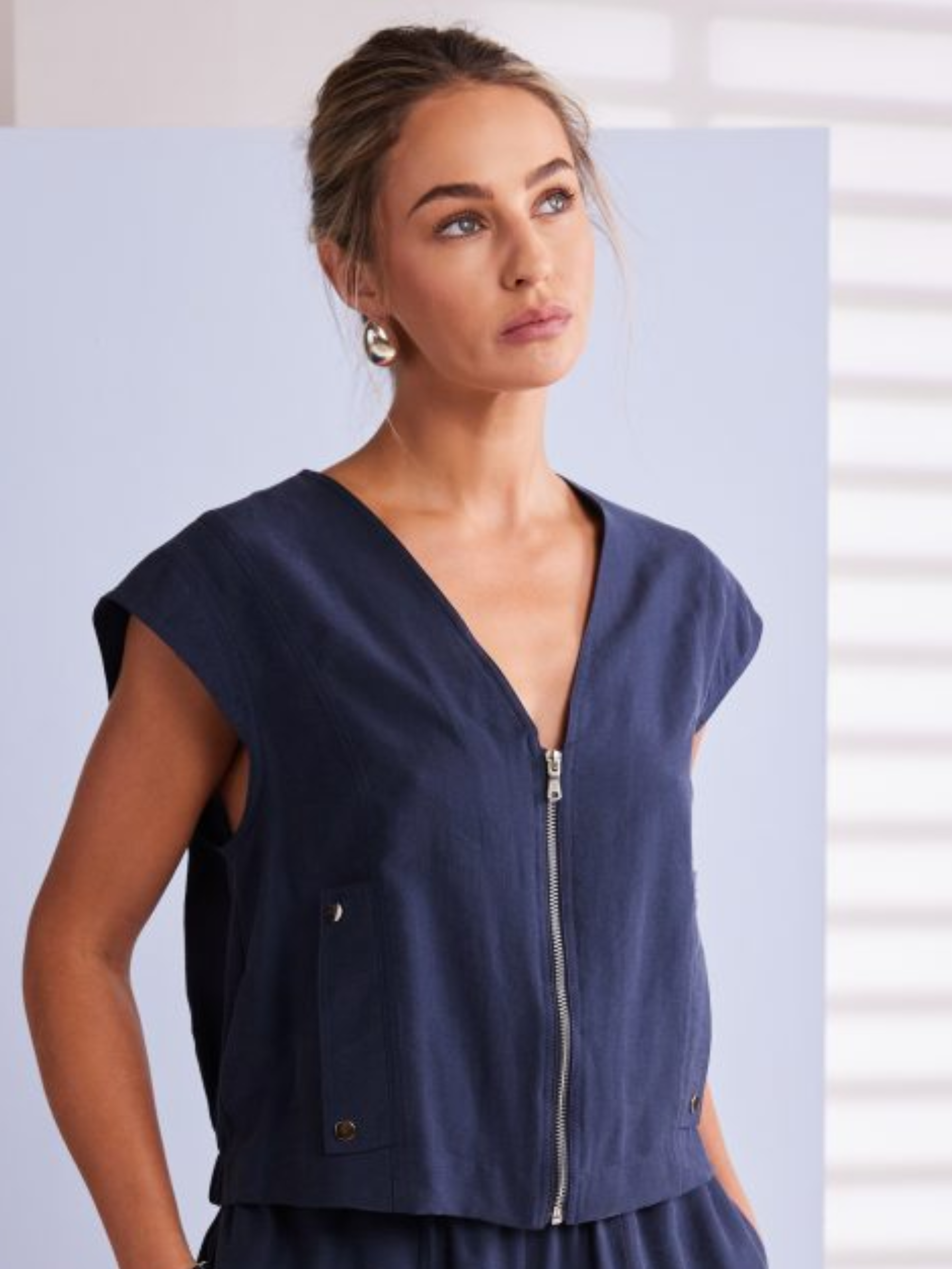 Naya NPA26 284 Short Zip V-Neck Top with zip front, V-neckline, sleeveless cut and pocket detail