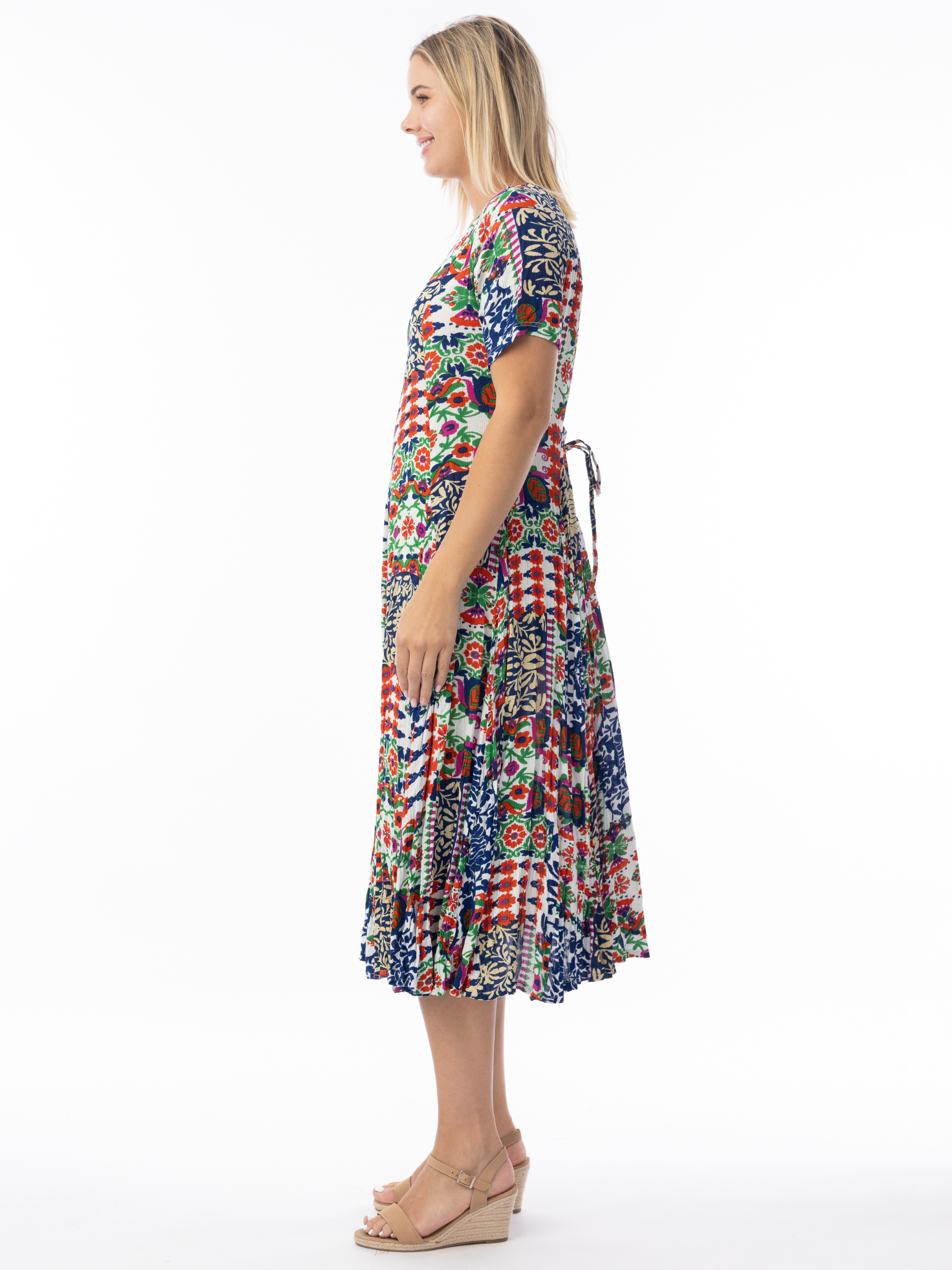 Orientique 30210 Buzios Godet Dress printed midi A-line dress with V-neckline, short sleeves and flared godet skirt.