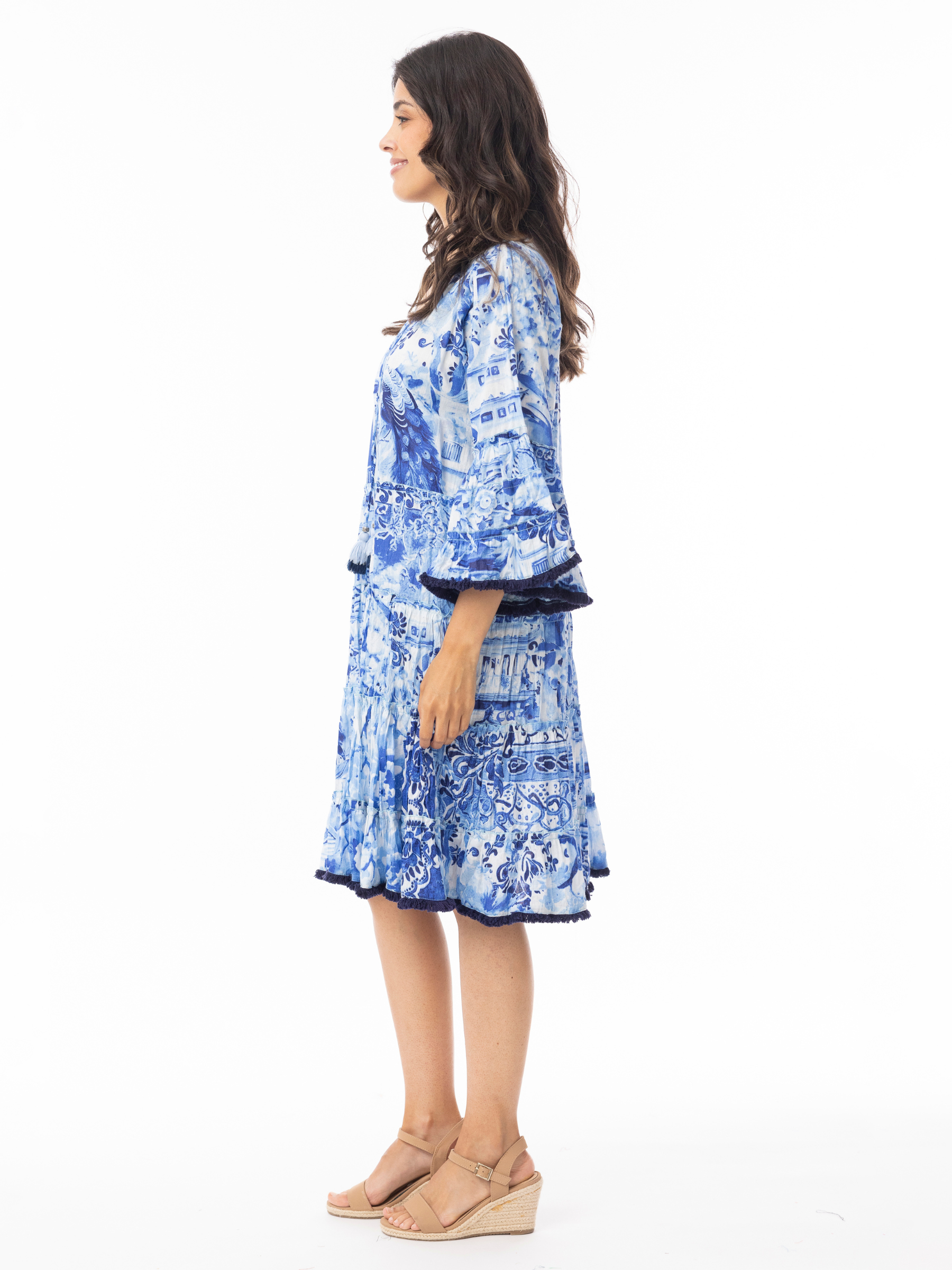 Orientique 40188 Okayama Dress printed tiered dress with V-neckline, tassel tie detail and wide sleeves.