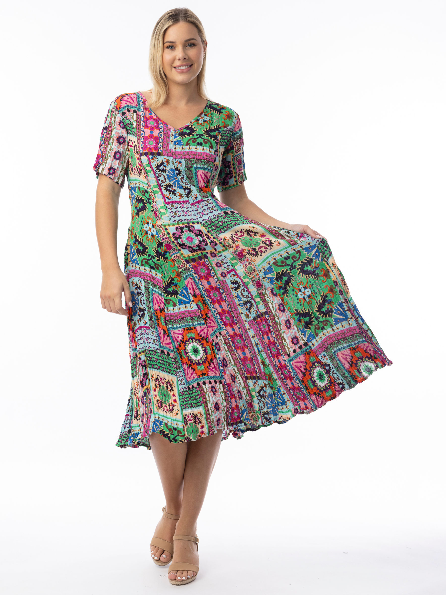 Orientique 61742 Sao Bento Gobet Dress with V-neckline, short flared sleeves and pleated gobet hem in vibrant patchwork-inspired print.