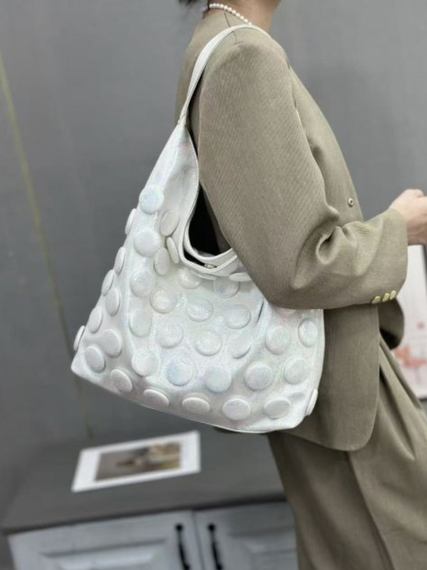 PCHA 60554 slouchy hobo handbag with raised 3D dot detailing, matching zip pouch and detachable strap.