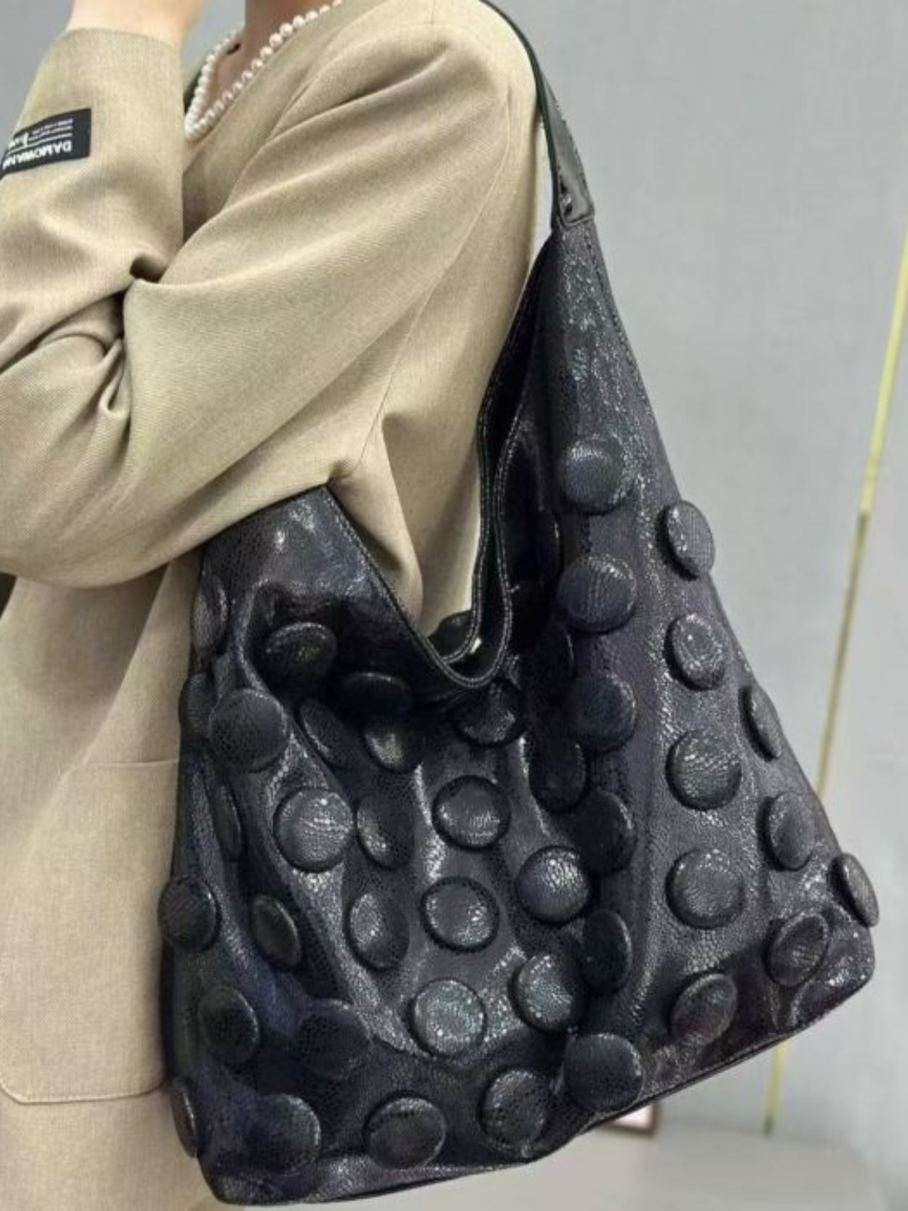 PCHA 60554 slouchy hobo handbag with raised 3D dot detailing, matching zip pouch and detachable strap.