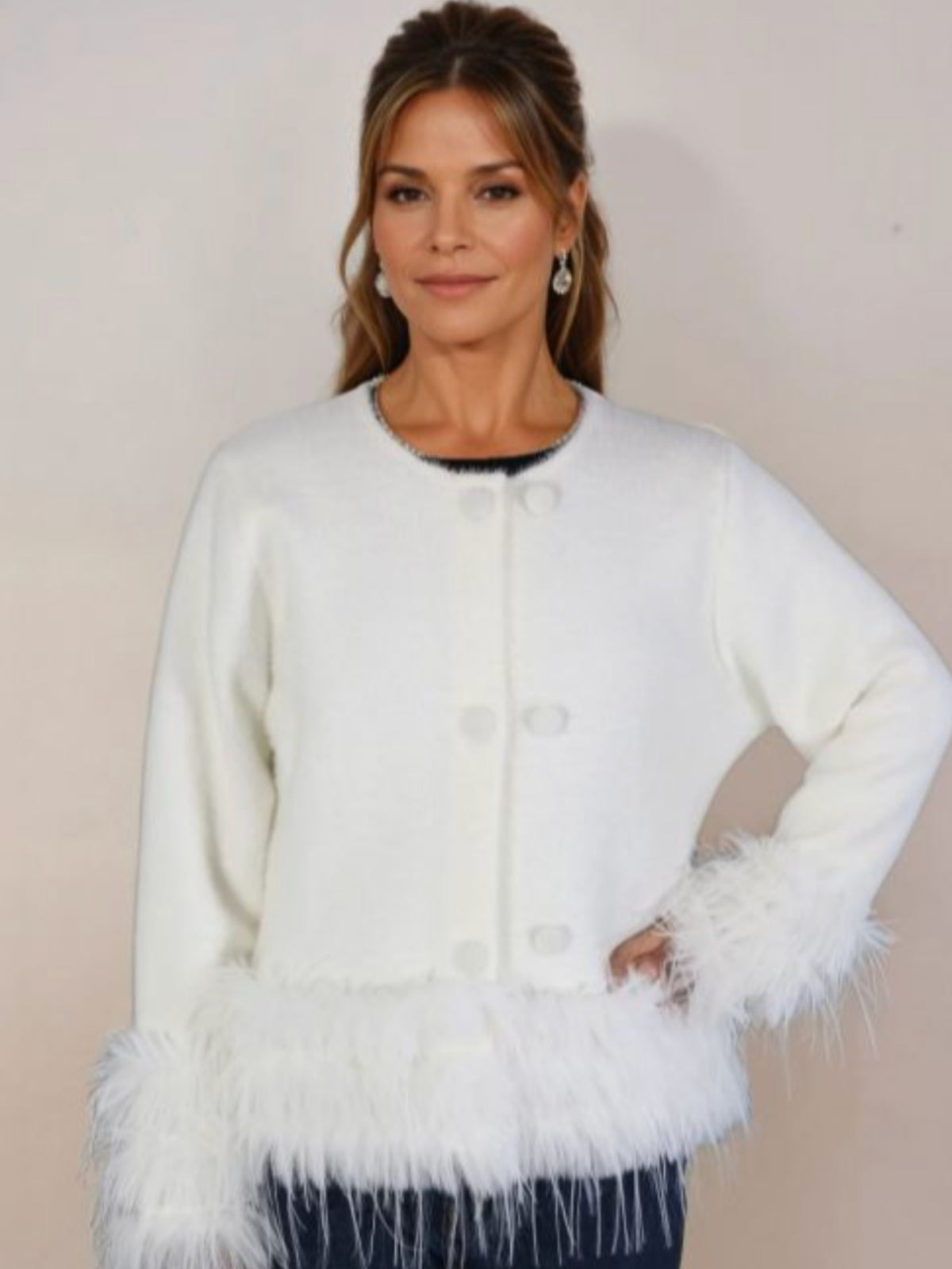 PCHA CA196 Feather Trim Cardigan with round neckline, button front and statement feather trim at the cuffs and hem.