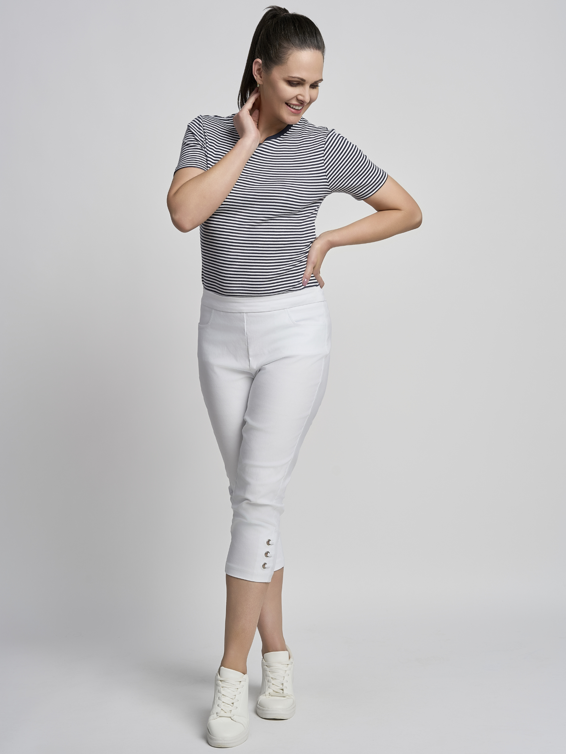 PINNS 408C white women’s sculpting bengaline crop trousers with hidden tummy control and diamond eyelet hem.