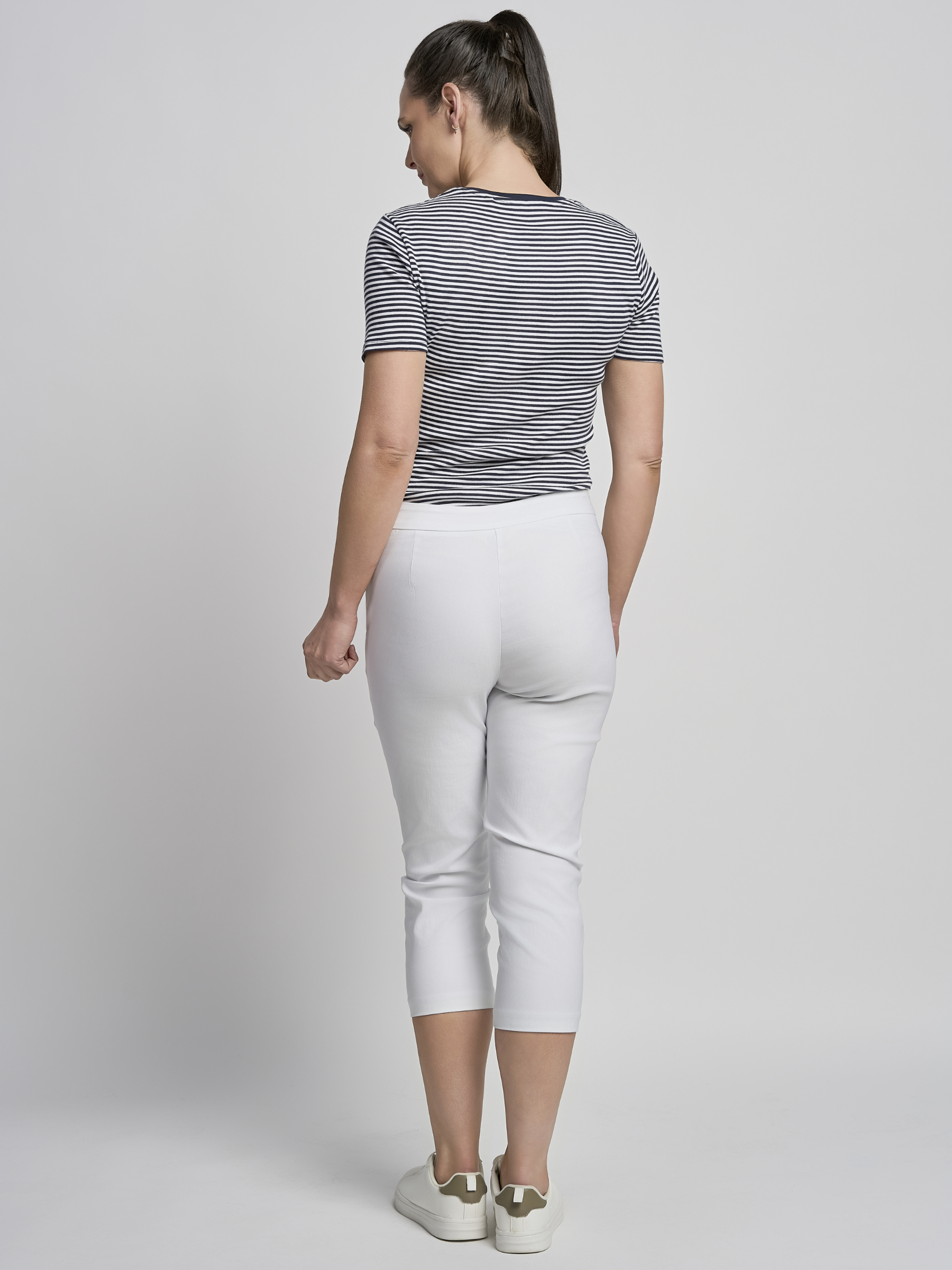 PINNS 408C white women’s sculpting bengaline crop trousers with hidden tummy control and diamond eyelet hem.