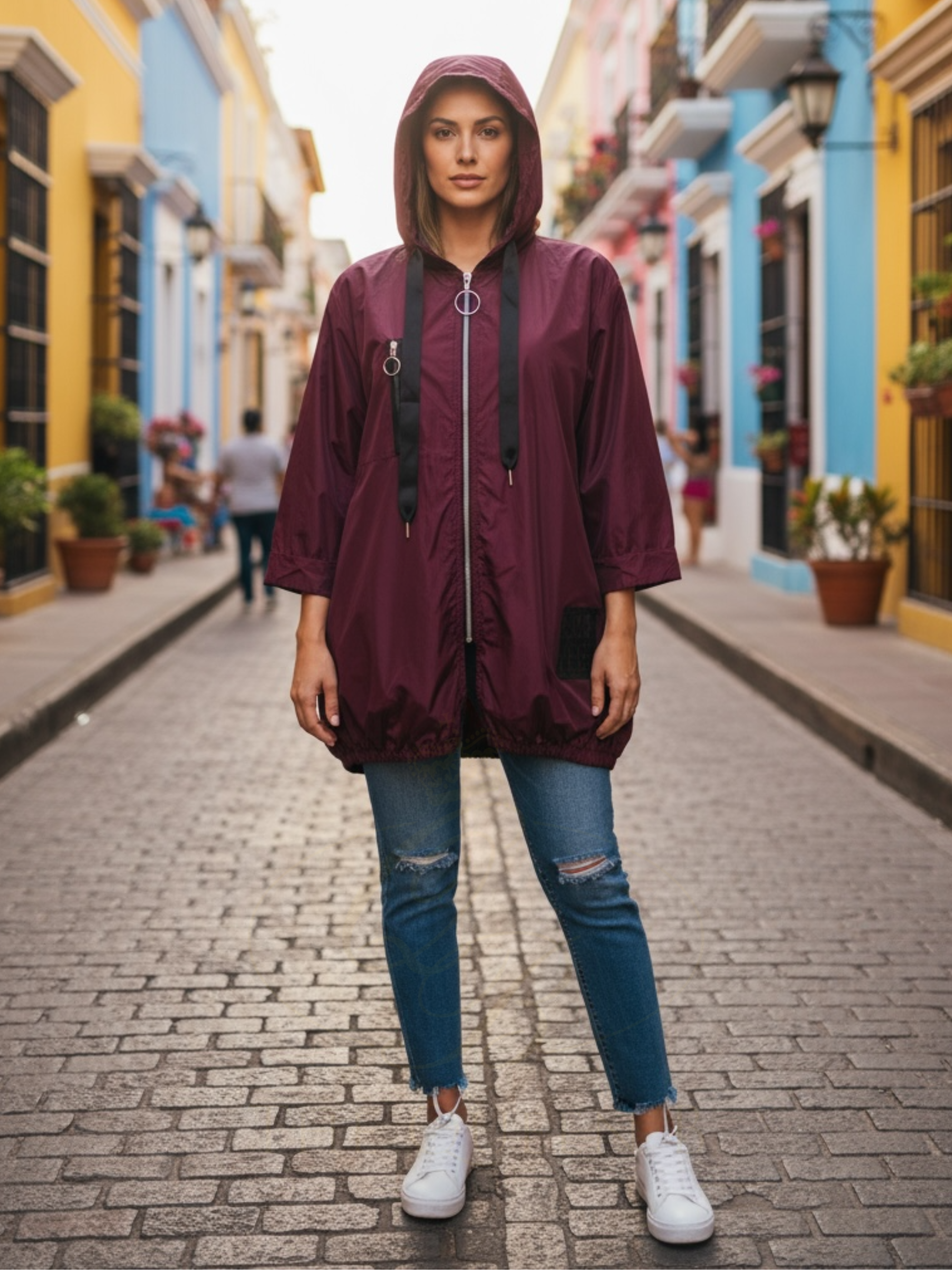 QBAW25 BC Harper Wine Red Rain Mac – women’s lightweight hooded raincoat with zip fastening and drawstring detail. Perfect for casual and travel wear.