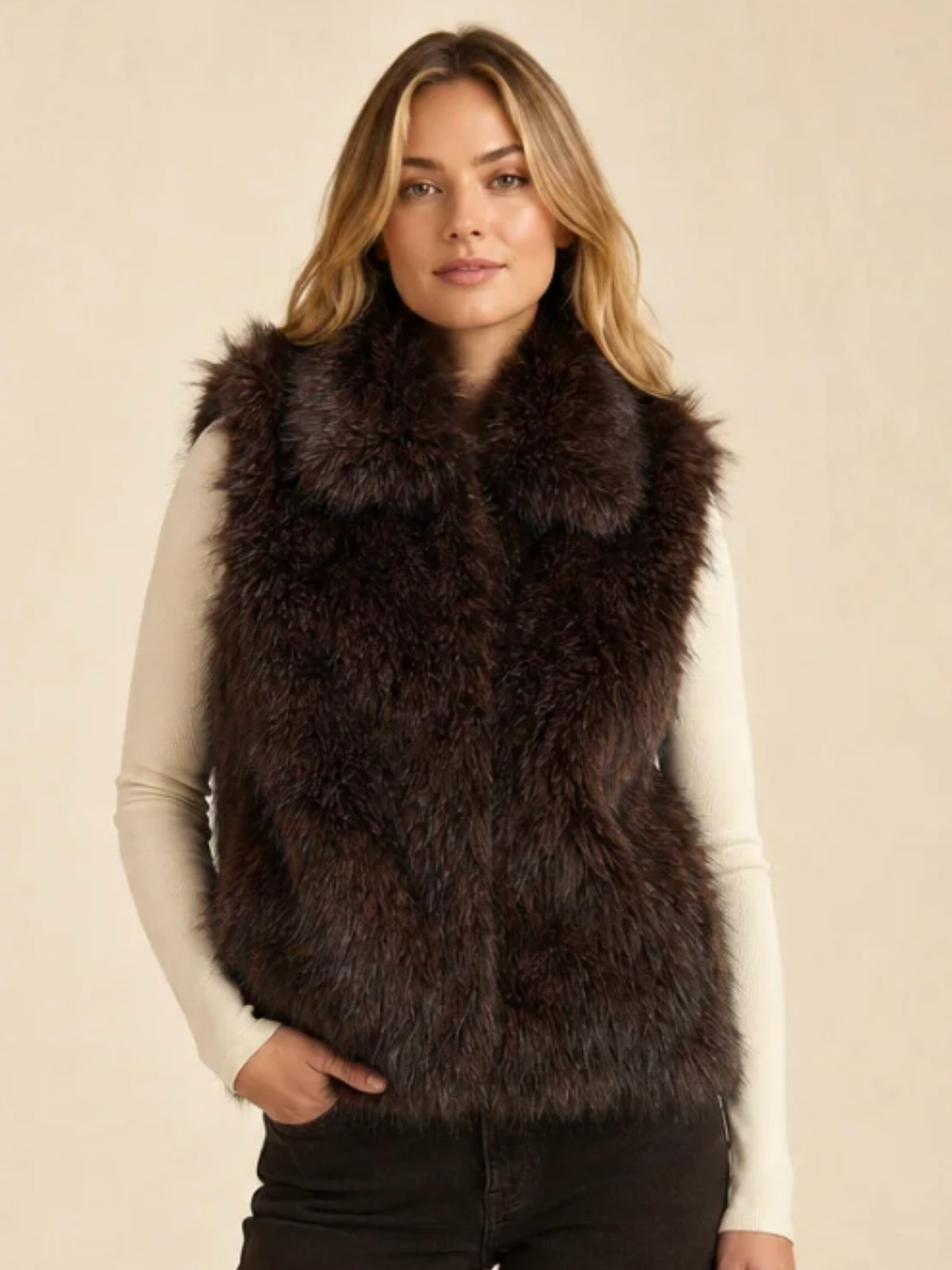 QBAW26 CW Darcy Faux Fur Short Gilet with soft textured finish, sleeveless design, high neckline and pockets.