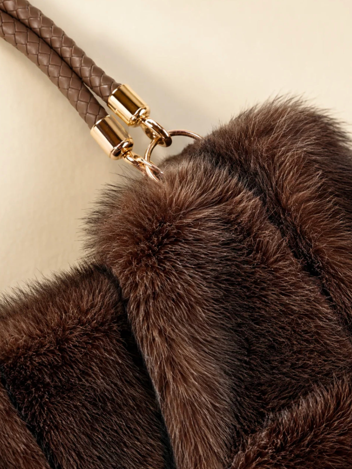 QBAW26 CW Grace Faux Fur Tote Bag with plush textured finish, structured shape, braided top handle and decorative hardware.