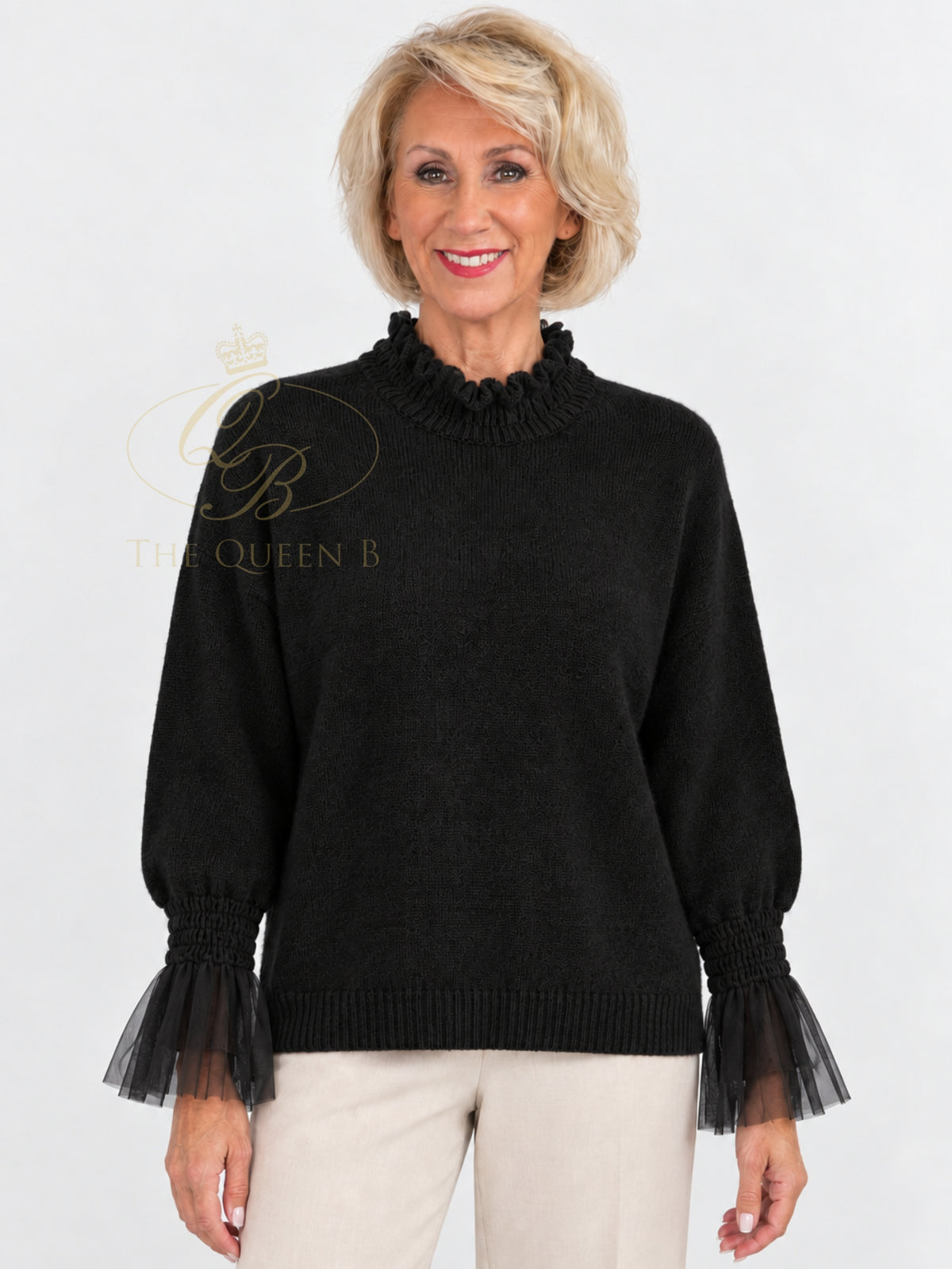 QBAW26 LX Poppy Jumper with ruffle high neckline, long balloon sleeves, sheer ruffle cuffs and ribbed hem.