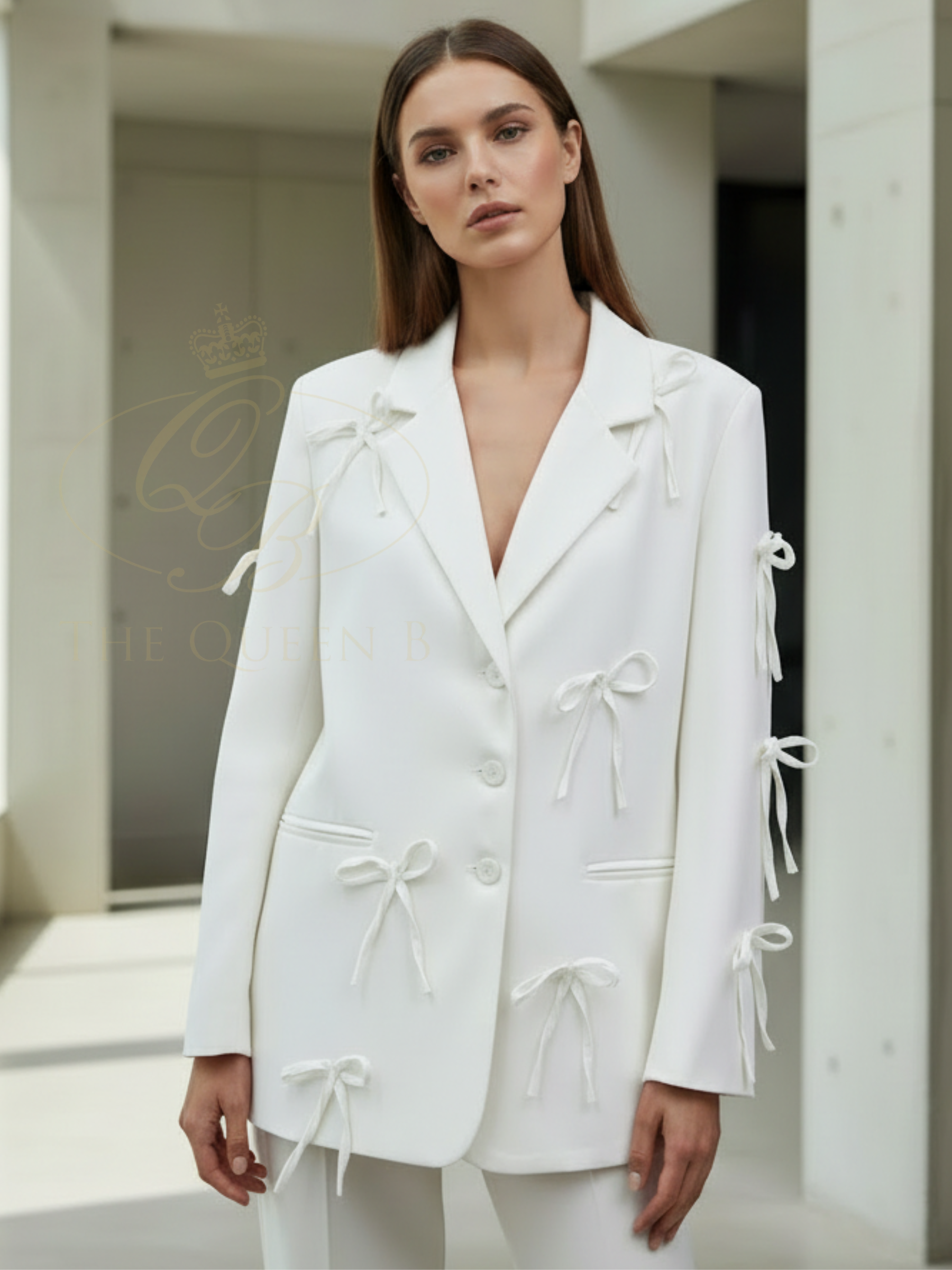 QBSS26 UA Jasmine Bow Blazer with tailored silhouette, bow detailing and classic lapel neckline, styled for an elegant finish.