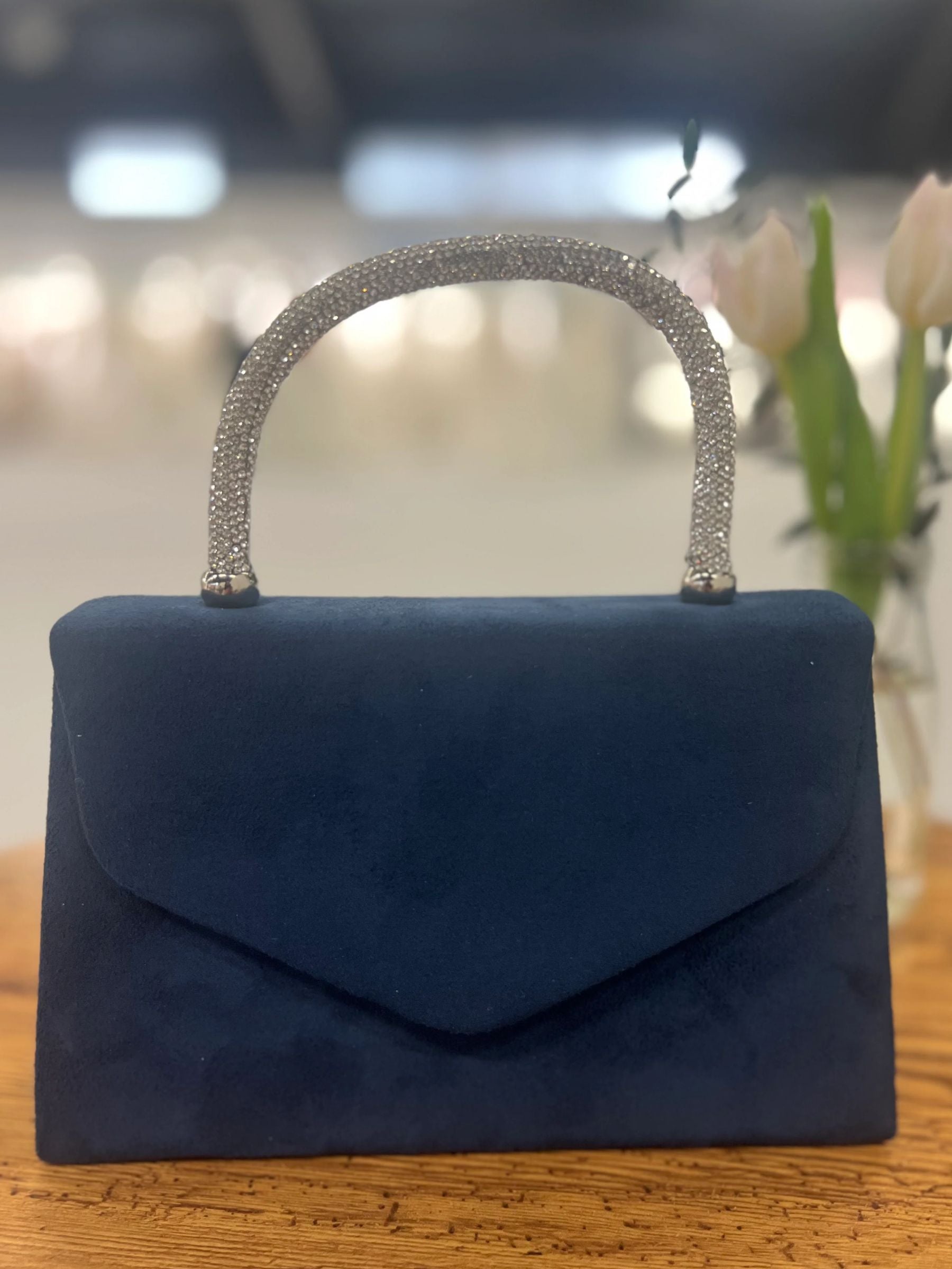 Navy structured handbag with sparkling rhinestone handle - elegant women’s evening bag for weddings, parties and chic occasionwear.