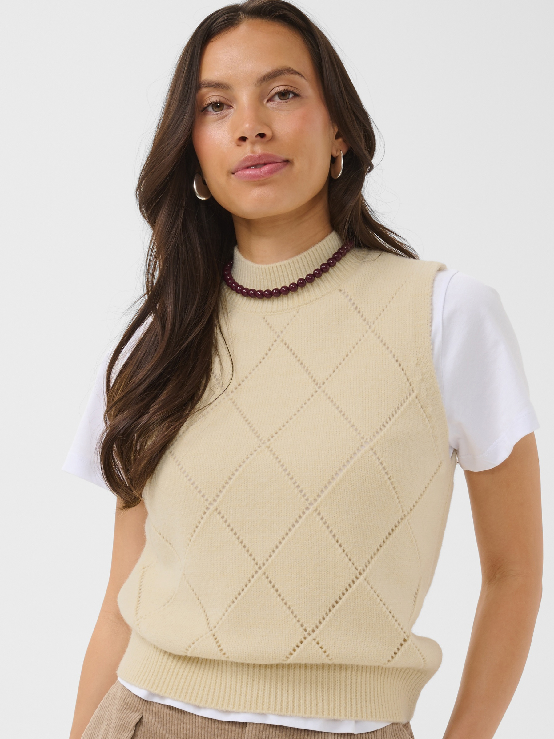Saint Tropez Theresa Vest with high round neckline, sleeveless shape, diamond stitch detail and ribbed trims