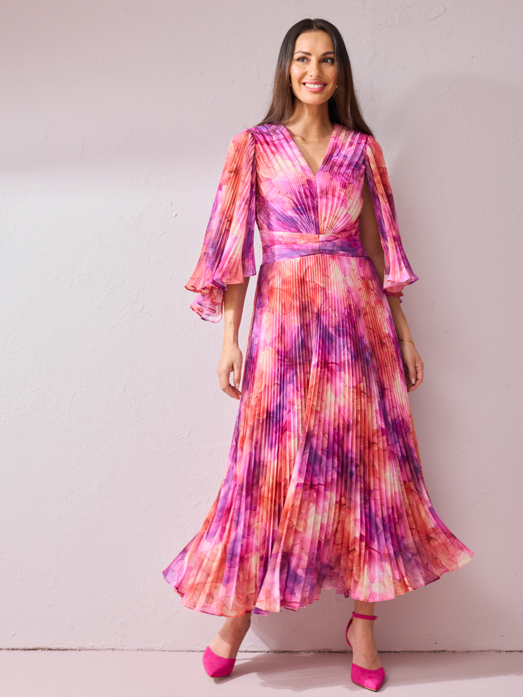 Samantha Jane Alice Pink Print Dress with pleated maxi skirt, wrap-style bodice and flowing silhouette.