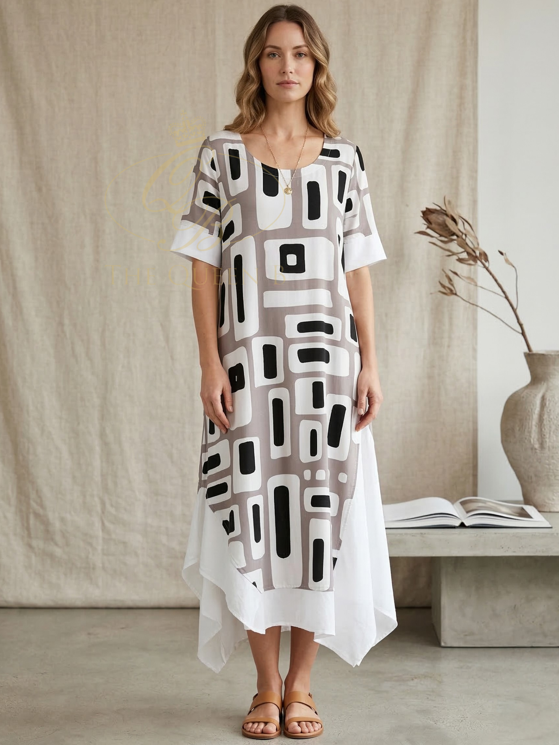 Tara Vao Magali 9047 Dress with relaxed shift silhouette, geometric print and layered asymmetric hem.