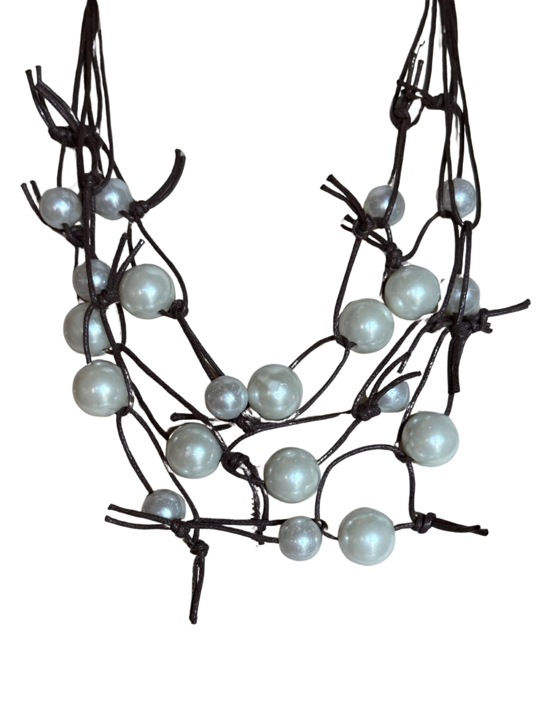Tara Vao N07 Necklace with knotted cord design and scattered pearl-style beads creating a sculptural statement necklace.