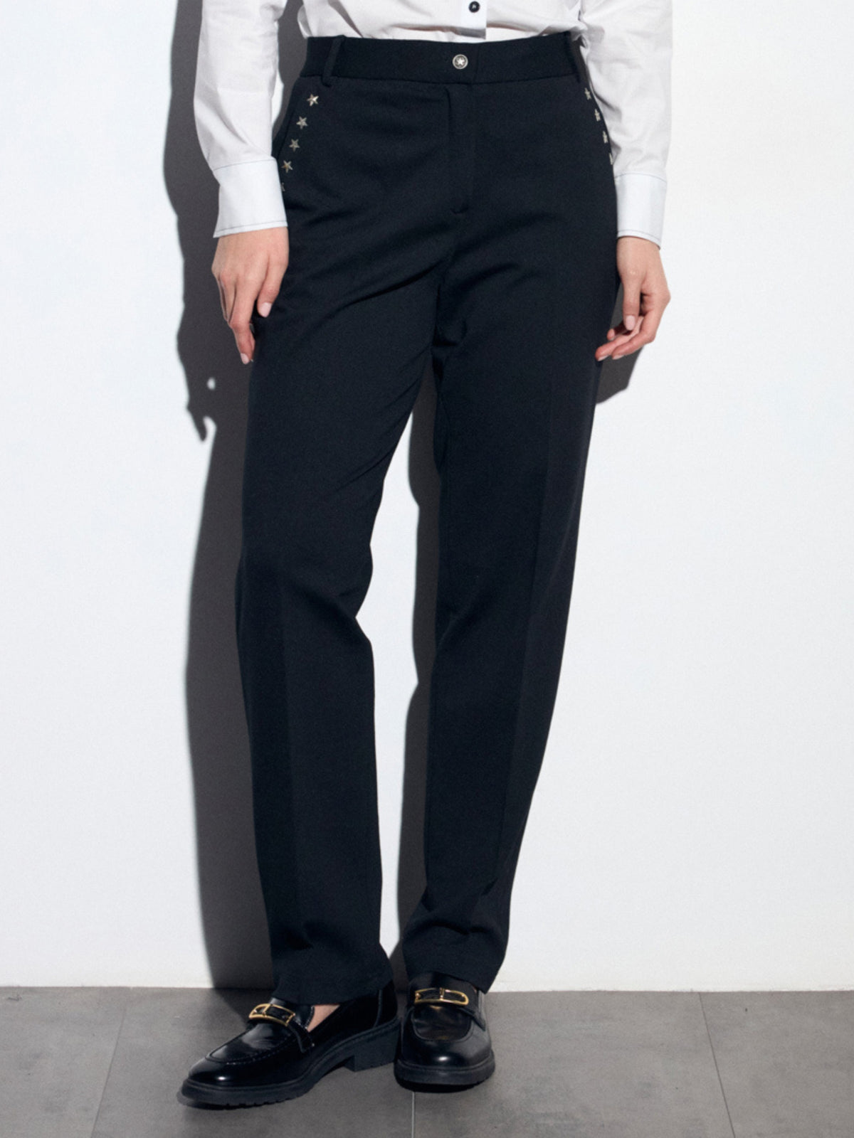 Tinta Edith Trousers with straight leg fit, tailored waistband, belt loops and subtle star detailing at the hips.