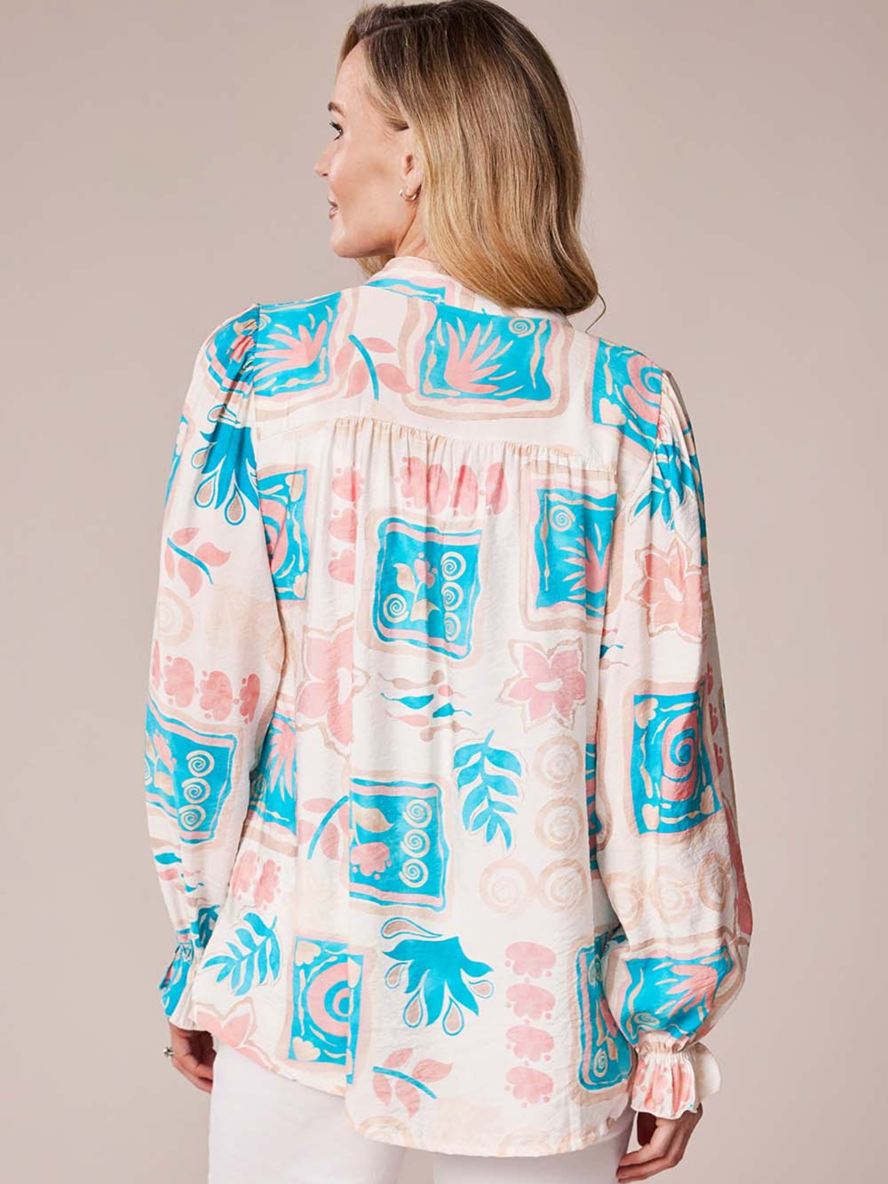 Deck By Decollage MC18022S printed blouse with notch neckline and long sleeves in lightweight fabric.