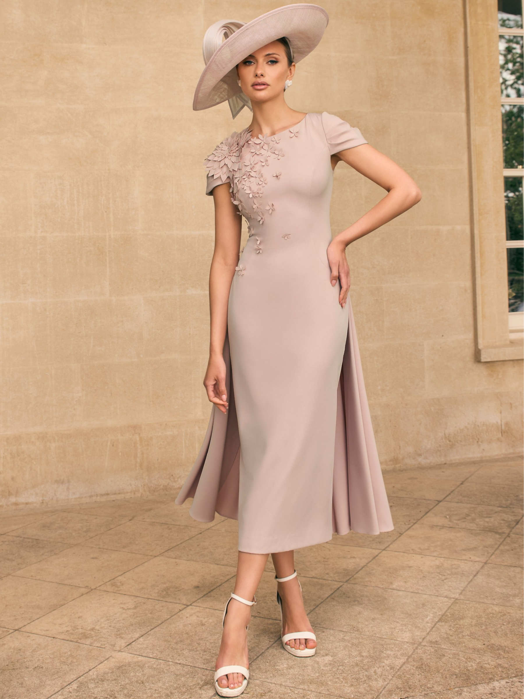 Veni Infantino 992719B Almond Dress with 3D floral appliqué, round neckline and flared A-line midi skirt. Elegant occasion dress ideal for weddings and special events.