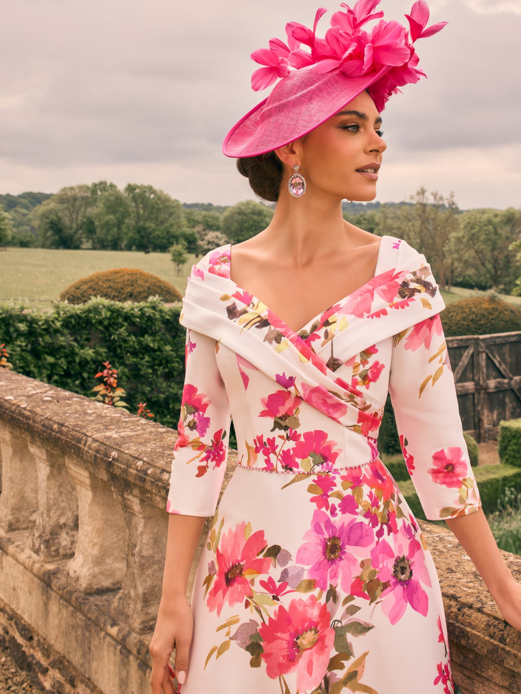 Veni Infantino 992733 Rosa Print Dress in mikado fabric with off-the-shoulder neckline and A-line midi skirt. Elegant floral occasion dress for weddings and special events.