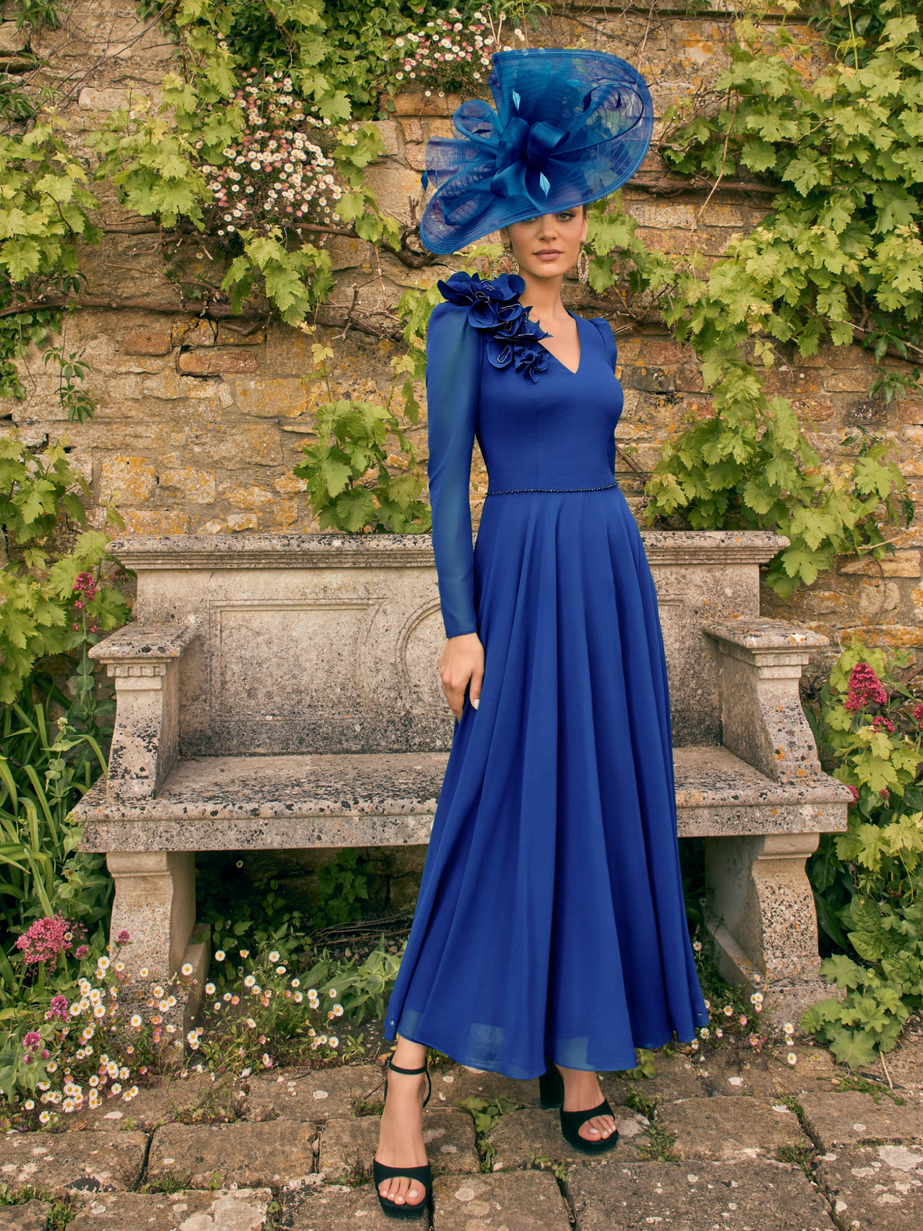 Veni Infantino 992778 Royal Blue Dress – elegant royal blue chiffon occasion dress with 3D floral appliqué, sheer sleeves and a flattering A-line silhouette, perfect for weddings and special events.
