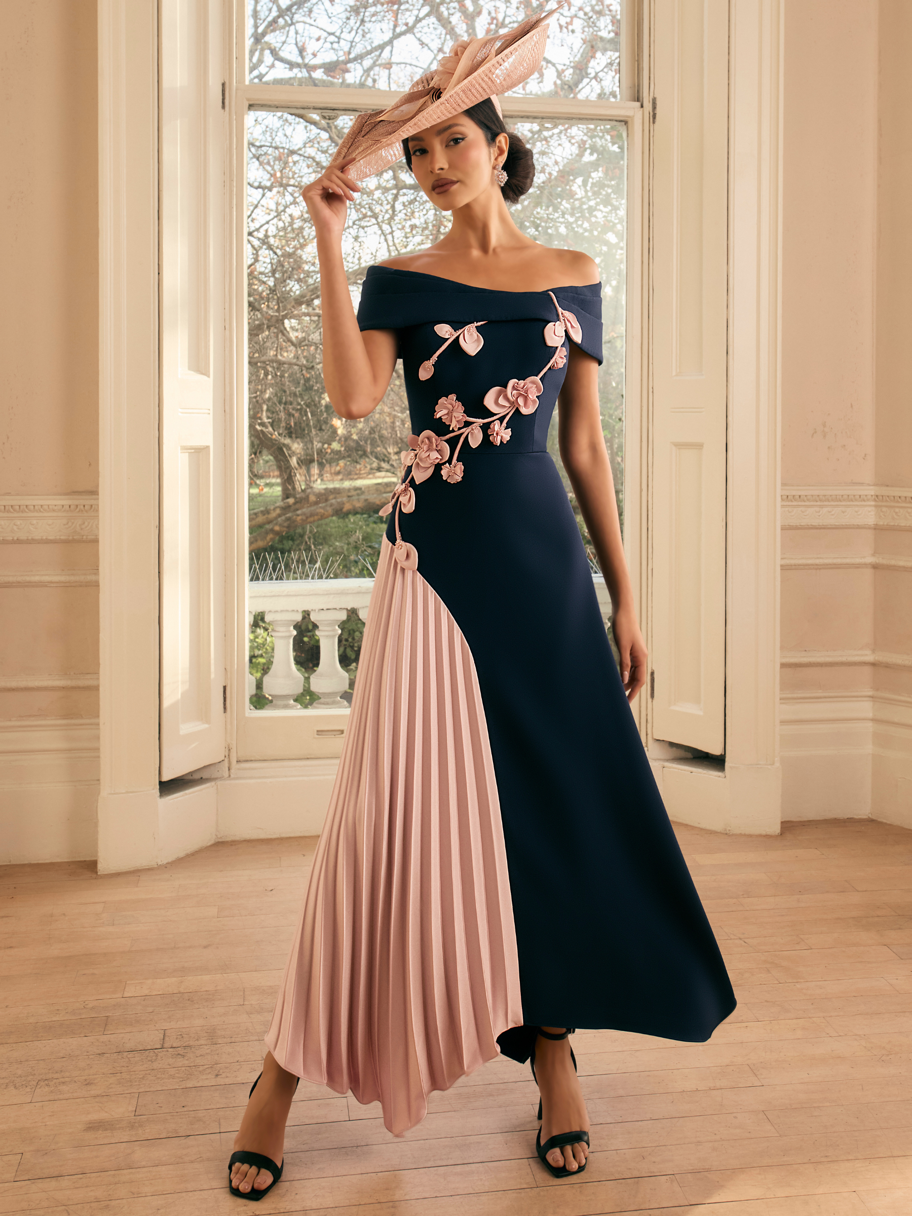 Veni Infantino 992814 Navy / Blush Dress with off-the-shoulder neckline, floral appliqué and pleated skirt panel