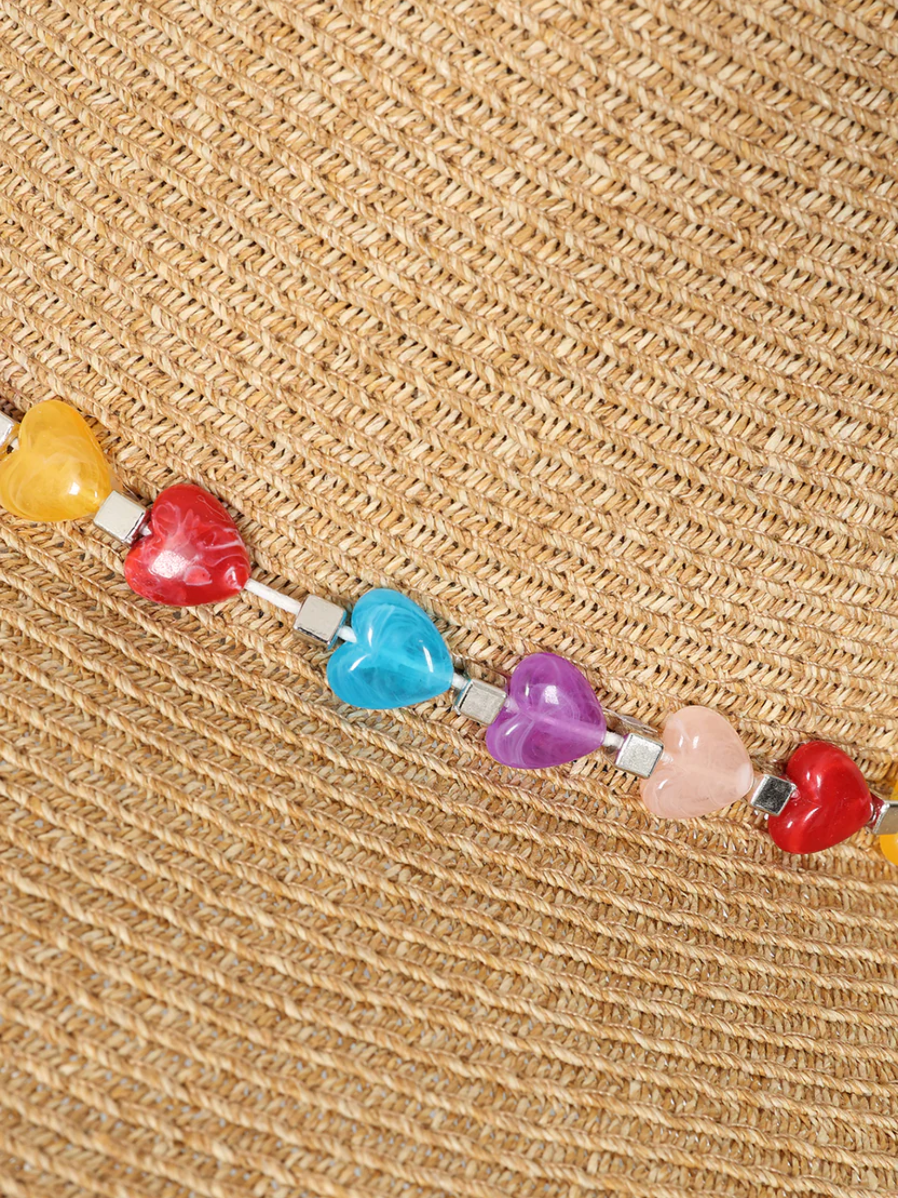 Alice Collins 036S221 Anne Hat with woven design, multicolour beaded band and decorative back detail.