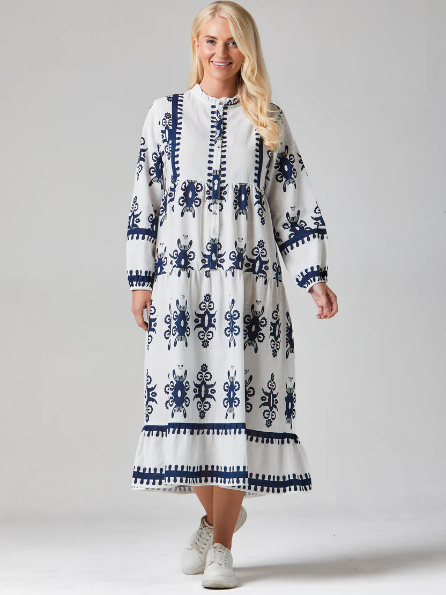 Alice Collins 036S460 Athena dress with printed design, tiered silhouette and long sleeves.