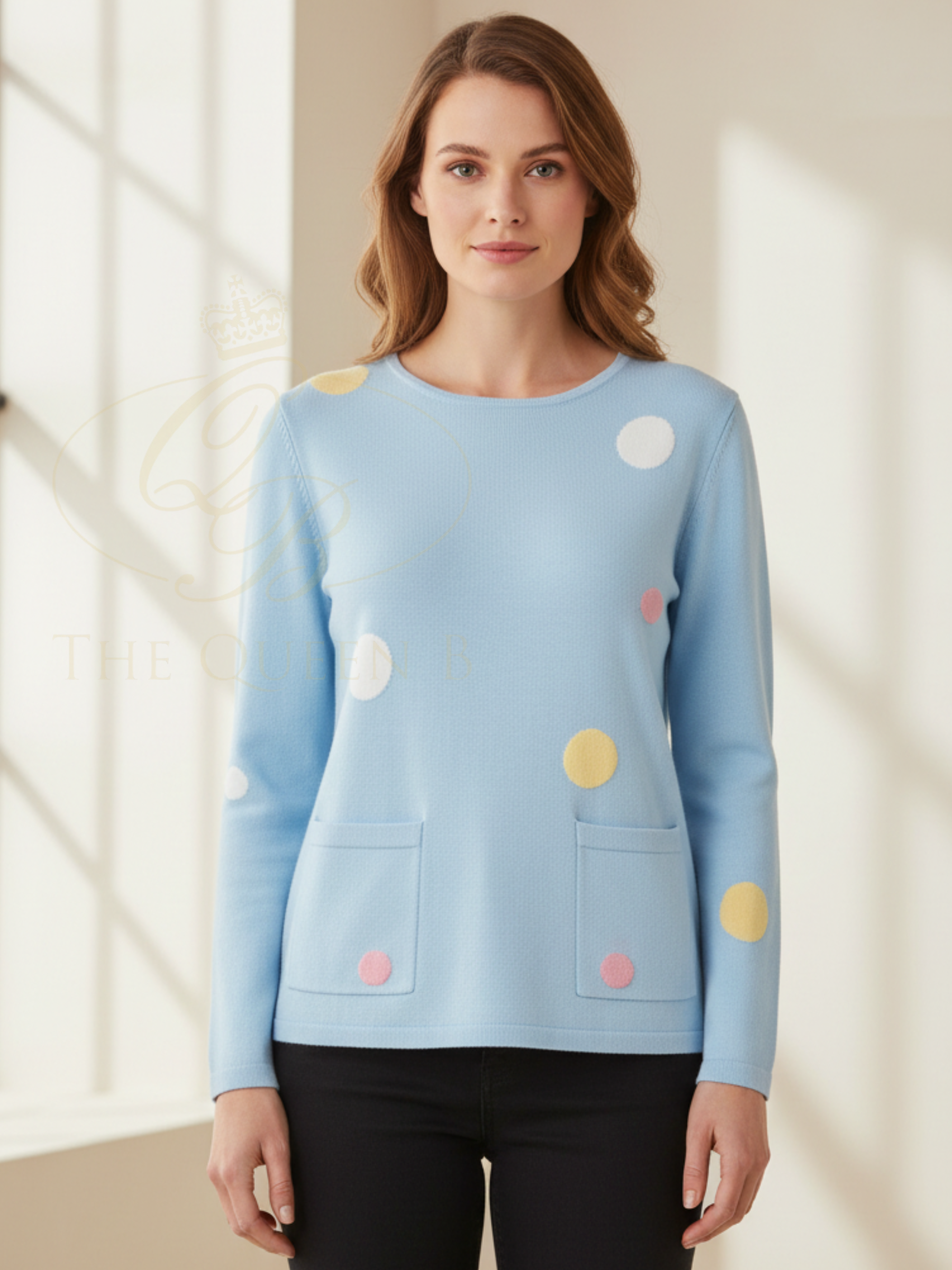 Alice Collins 036S560 Nicola Pullover with polka dot design and front patch pockets in soft knit fabric.