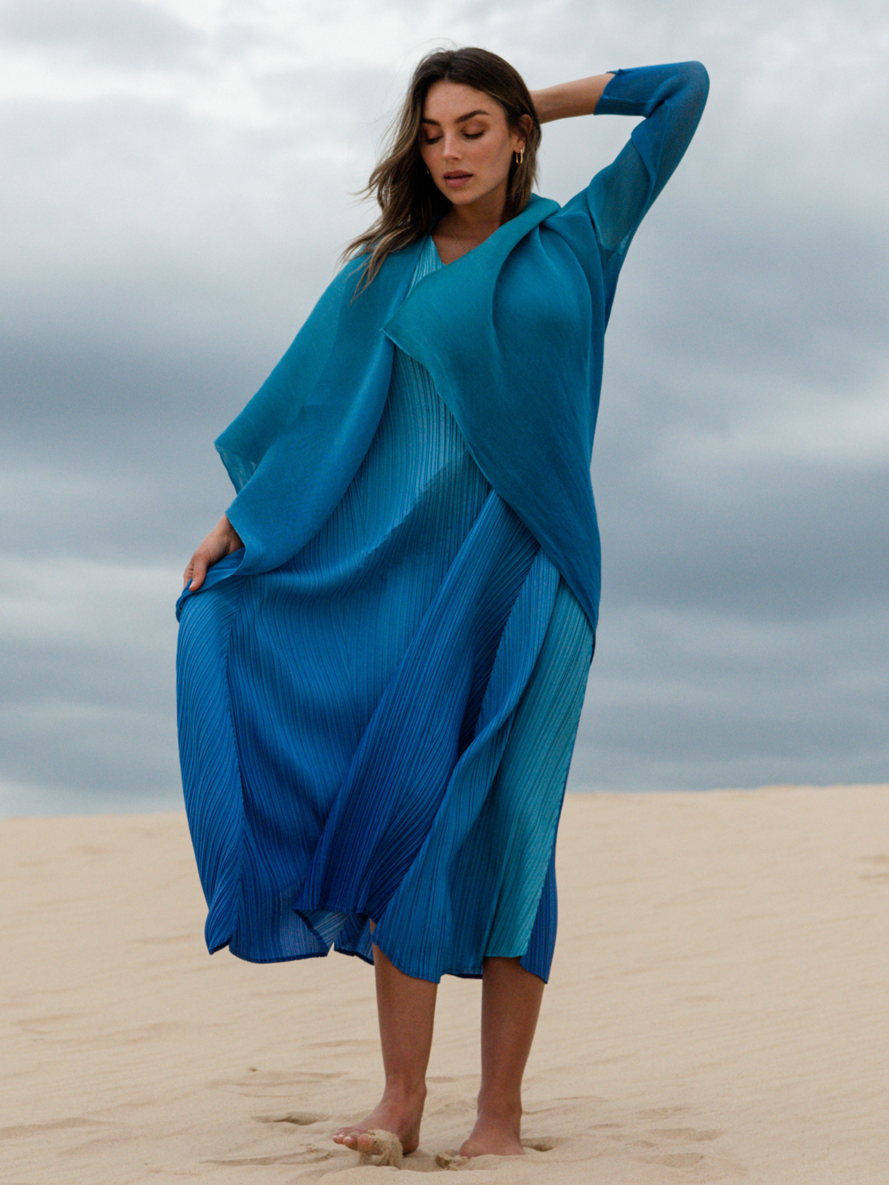 Alquema Blue Bird Dazzling Blue Dress & Coat hand-pleated dress and coat set in rich blue tones with fluid silhouette and draped open-front coat.