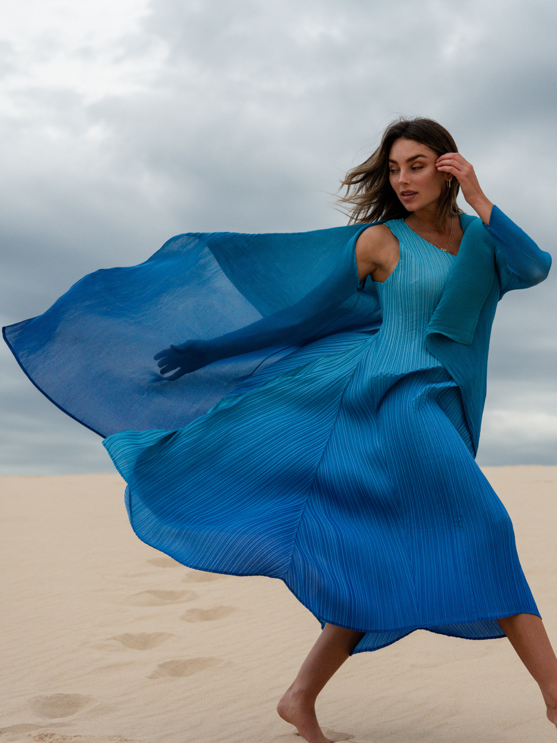 Alquema Blue Bird Dazzling Blue Dress & Coat hand-pleated dress and coat set in rich blue tones with fluid silhouette and draped open-front coat.