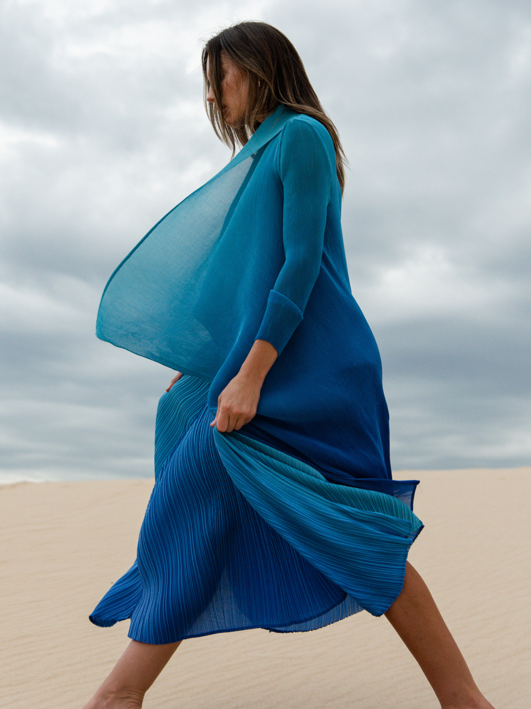 Alquema Blue Bird Dazzling Blue Dress & Coat hand-pleated dress and coat set in rich blue tones with fluid silhouette and draped open-front coat.