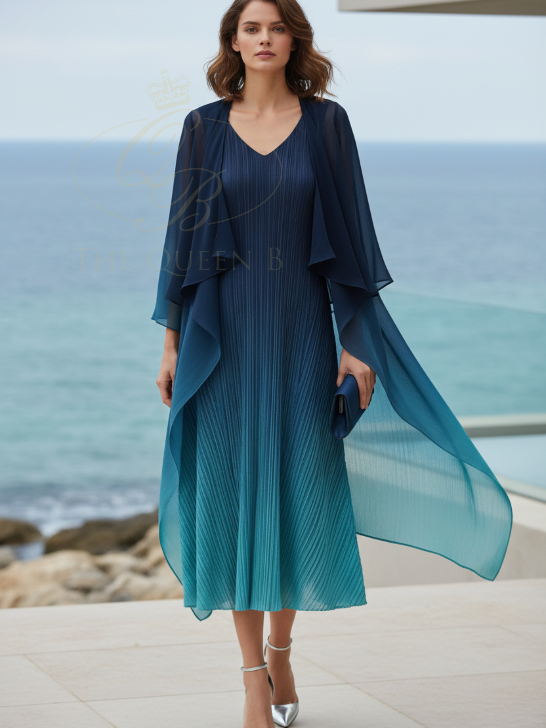 Alquema Twilight Blue Peacock Dress & Coat hand-pleated sleeveless dress with matching sheer coat, featuring fluid pleating, cascading drape panels and a flowing silhouette in twilight blue tones.