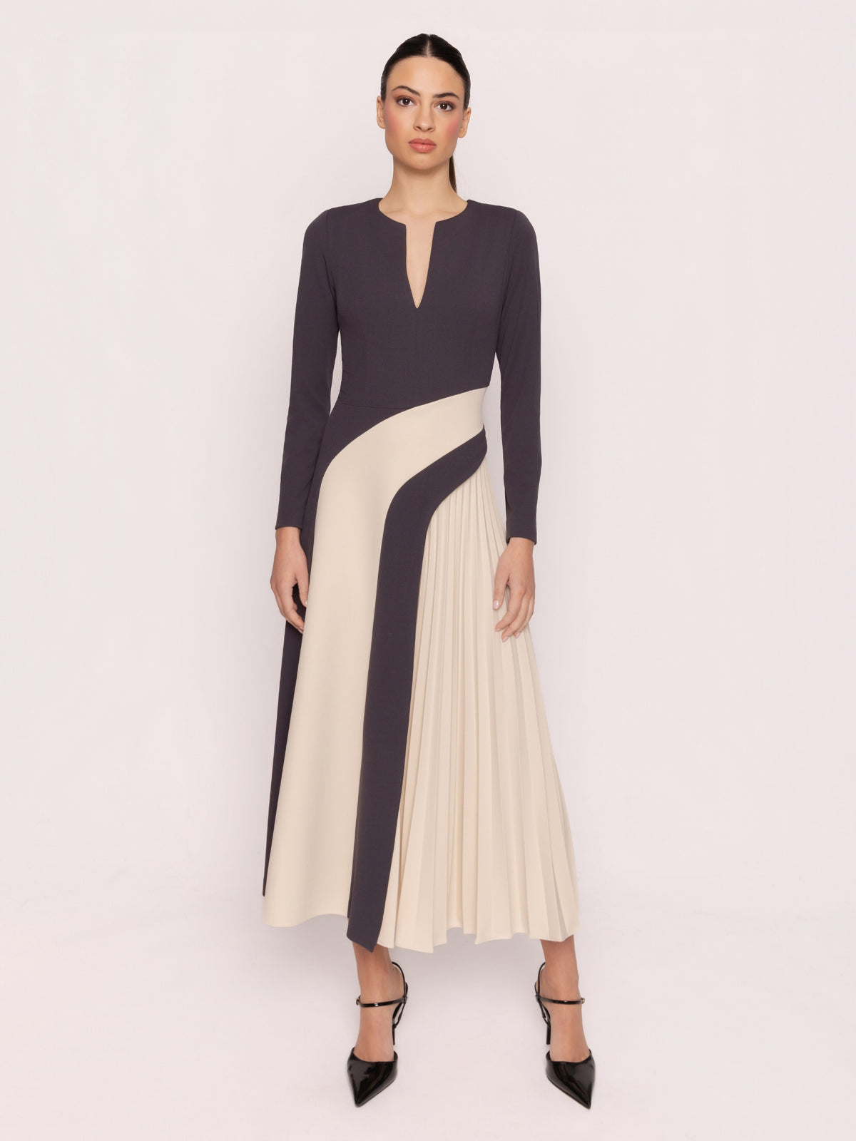 Arggido 21061 Bicolour Pleated Dress with split neckline, long sleeves, contrast panel detailing and pleated midi skirt.