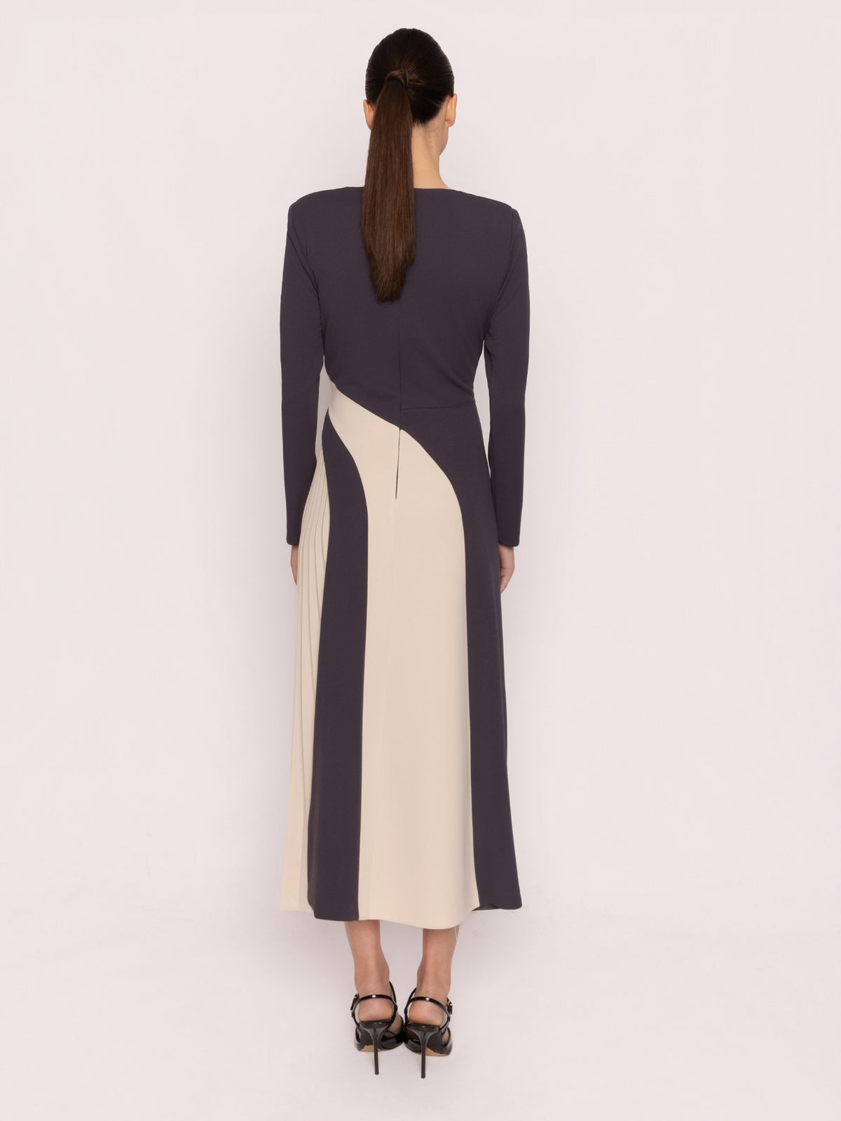 Arggido 21061 Bicolour Pleated Dress with split neckline, long sleeves, contrast panel detailing and pleated midi skirt.